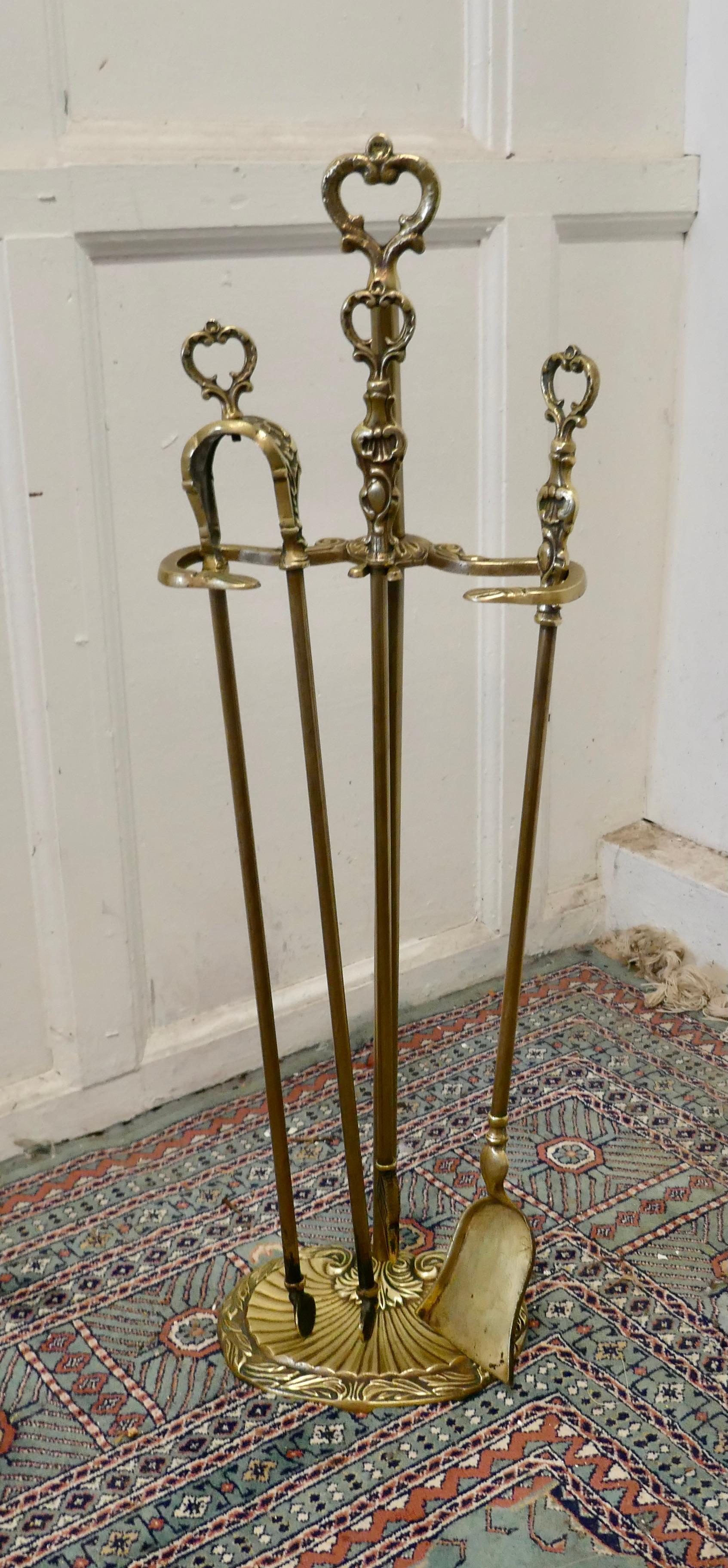 Attractive brass fireside companion set, fireside tools

This is a long handled set on its own stand, shovel, tongs and poker 
Measures: The stand 30” tall, 10” wide and 7” deep
TNV188.
     