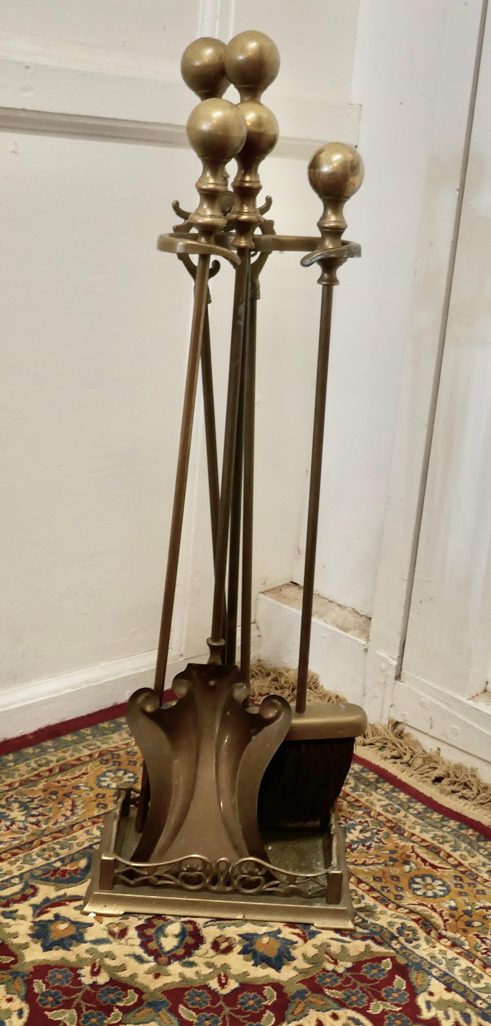 Attractive Brass Fireside Companion Set, Fireside Tools

This is a long handled set on its own stand, shovel, tongs and poker 
The stand 30” tall, 11” wide and 7” deep
AC69.