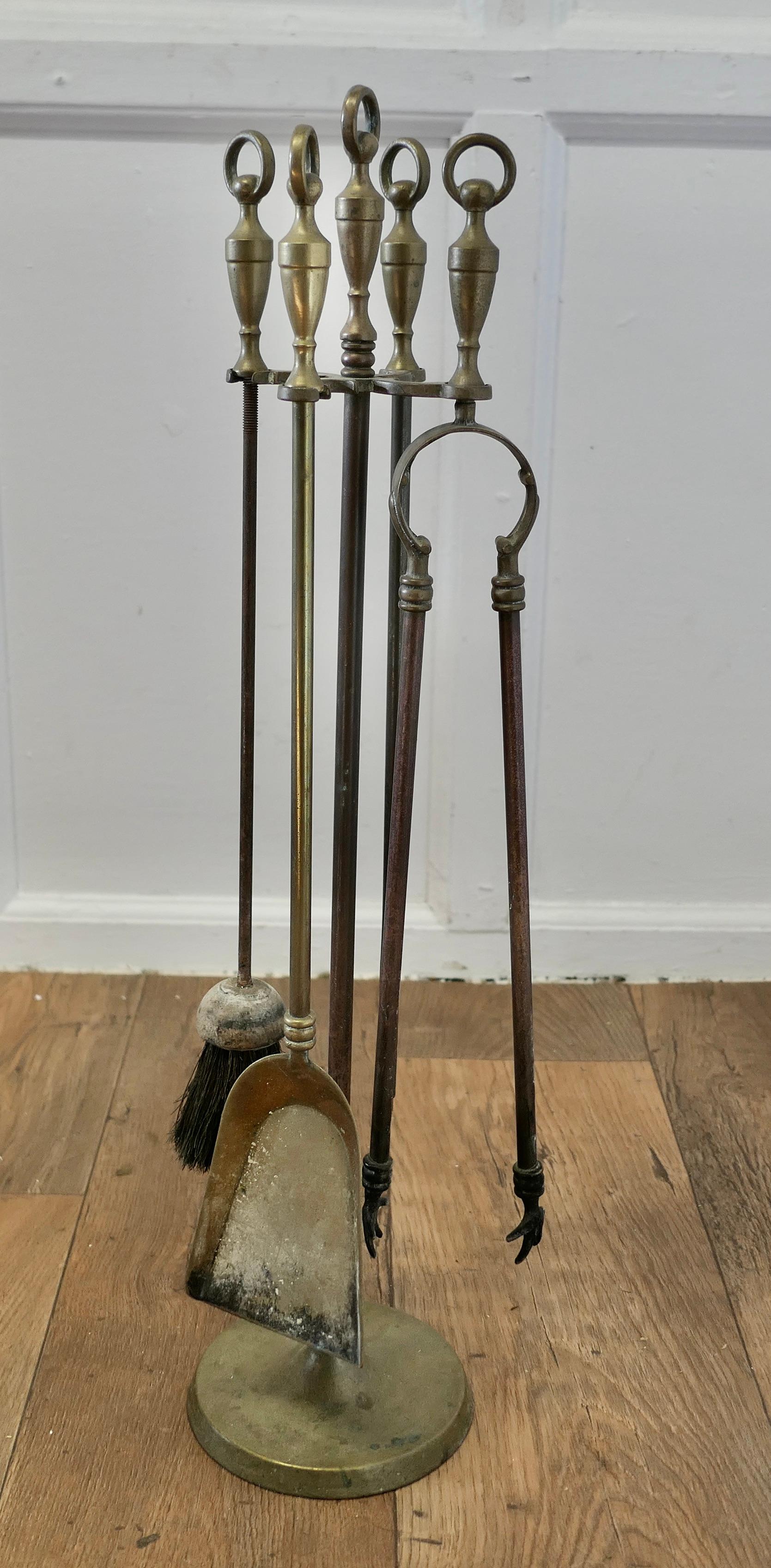 Attractive Brass Fireside Companion Set, Fireside Tools

This is a long handled set on its own stand, shovel, tongs, brush and poker  
The stand 28” tall and 6” in diameter
SC163