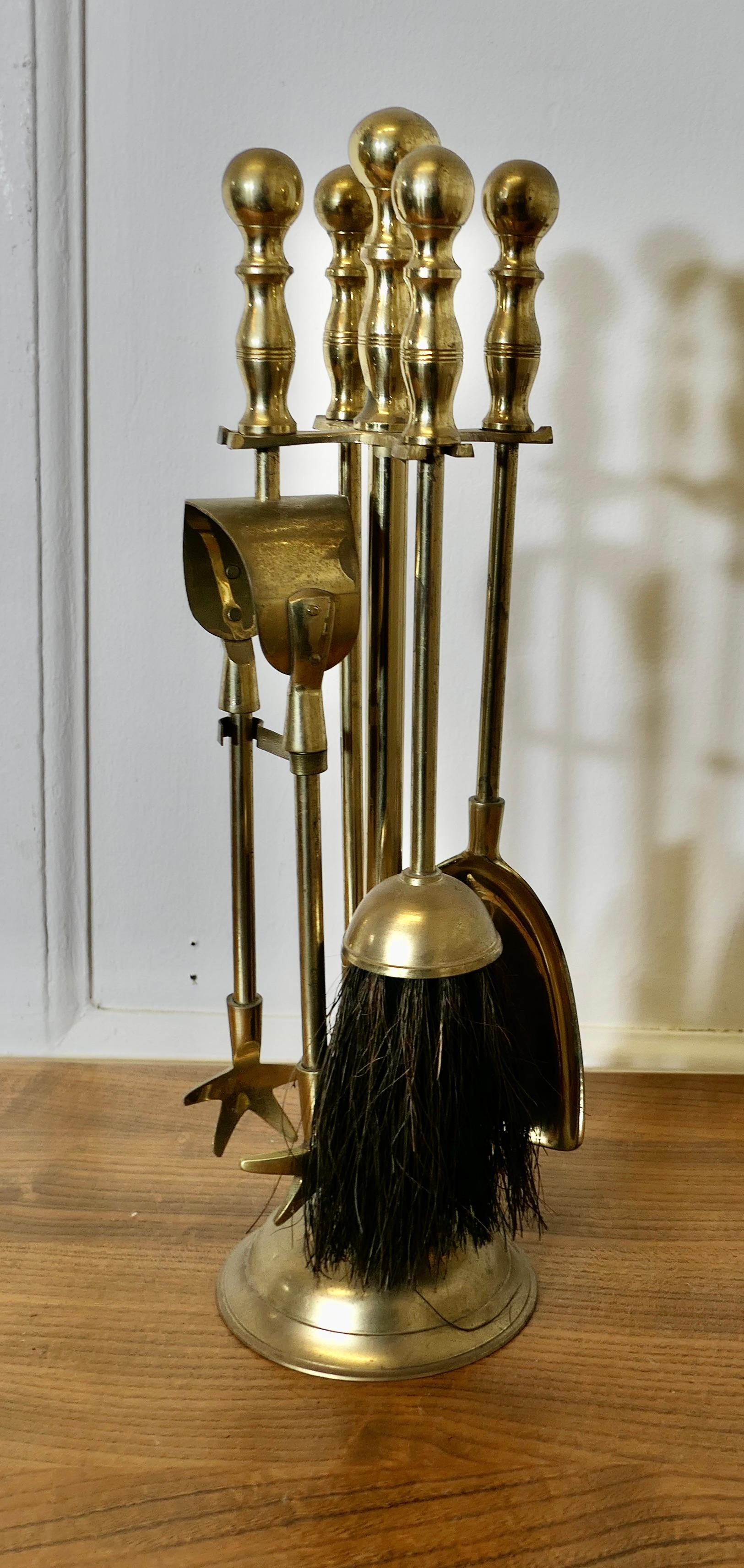 Attractive Brass Fireside Companion Set, Fireside Tools

This is a very attractive set on its own stand, shovel, tongs, brush and poker  
The stand 16” tall and 4” in diameter
FB133