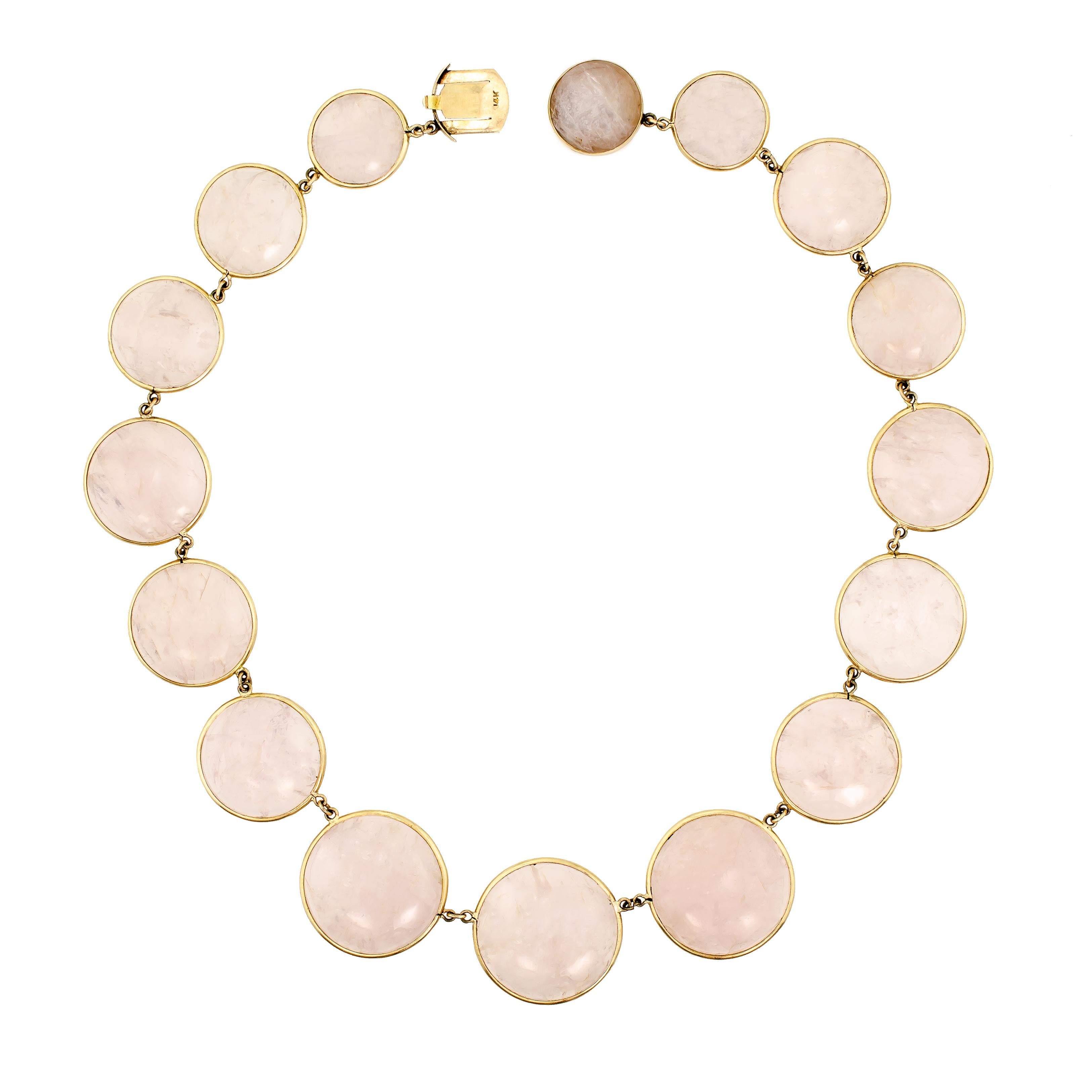 Attractive circa 1970 rose quartz and yellow gold circle necklace - set with 16 round graduated rose quartz cabochons (including one as a hidden clasp) yellow gold mount - 15 1/2