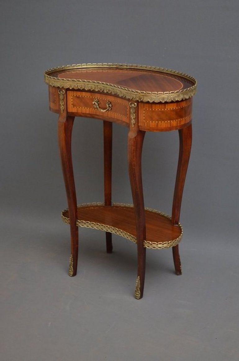 Sn3368 Attractive Continental, kidney shaped occasional table in mahogany, having original brass gallery to edge, string inlaid top with zebrano wood banded drawers, flanked by original brass bows, raise on slender cabriole legs united by shaped