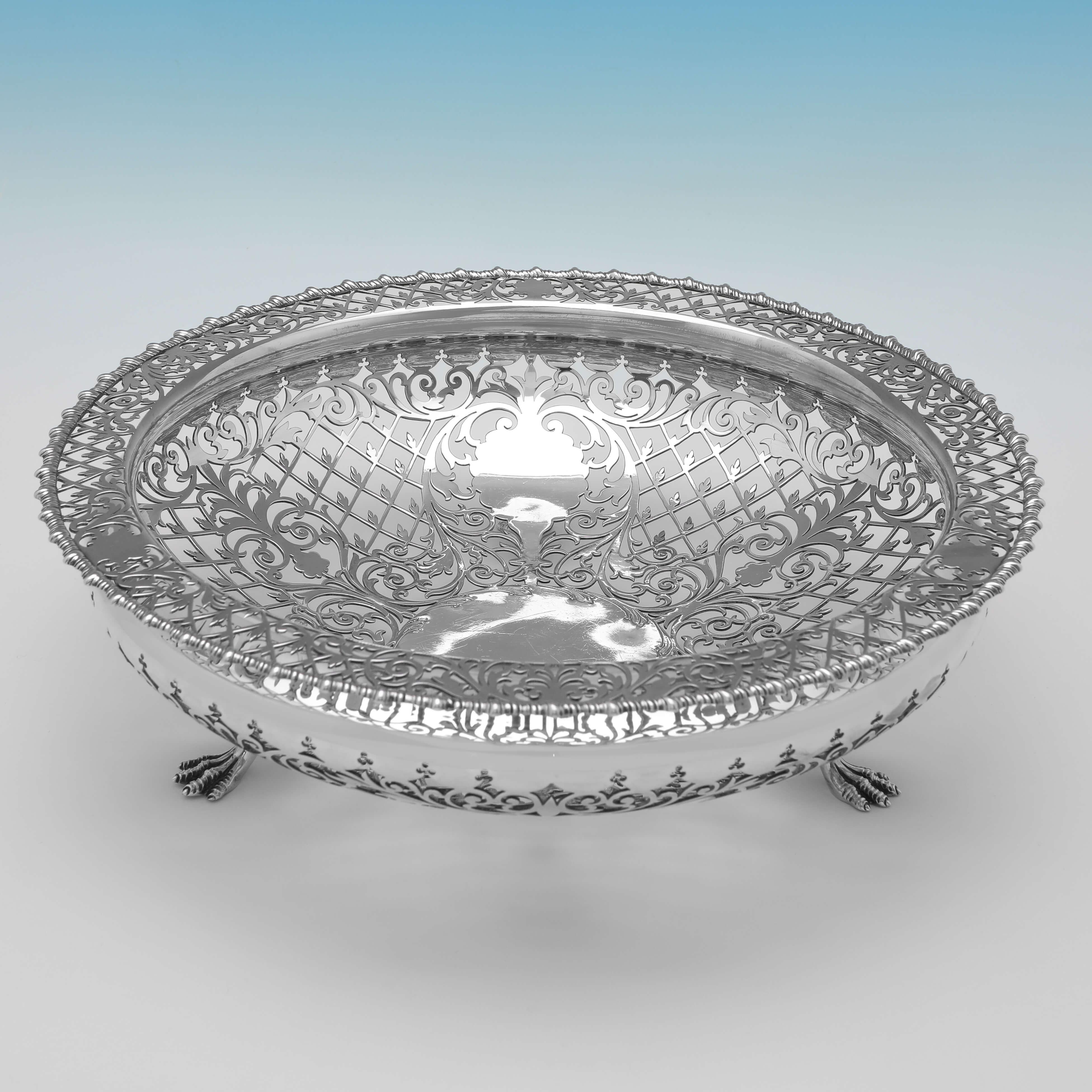 Hallmarked in Sheffield in 1905 by James Dixon & Sons, this attractive, Edwardian, Antique Sterling Silver Dish, stands on 3 paw feet, and features wonderfully pierced decoration. 

The dish measures 3.5