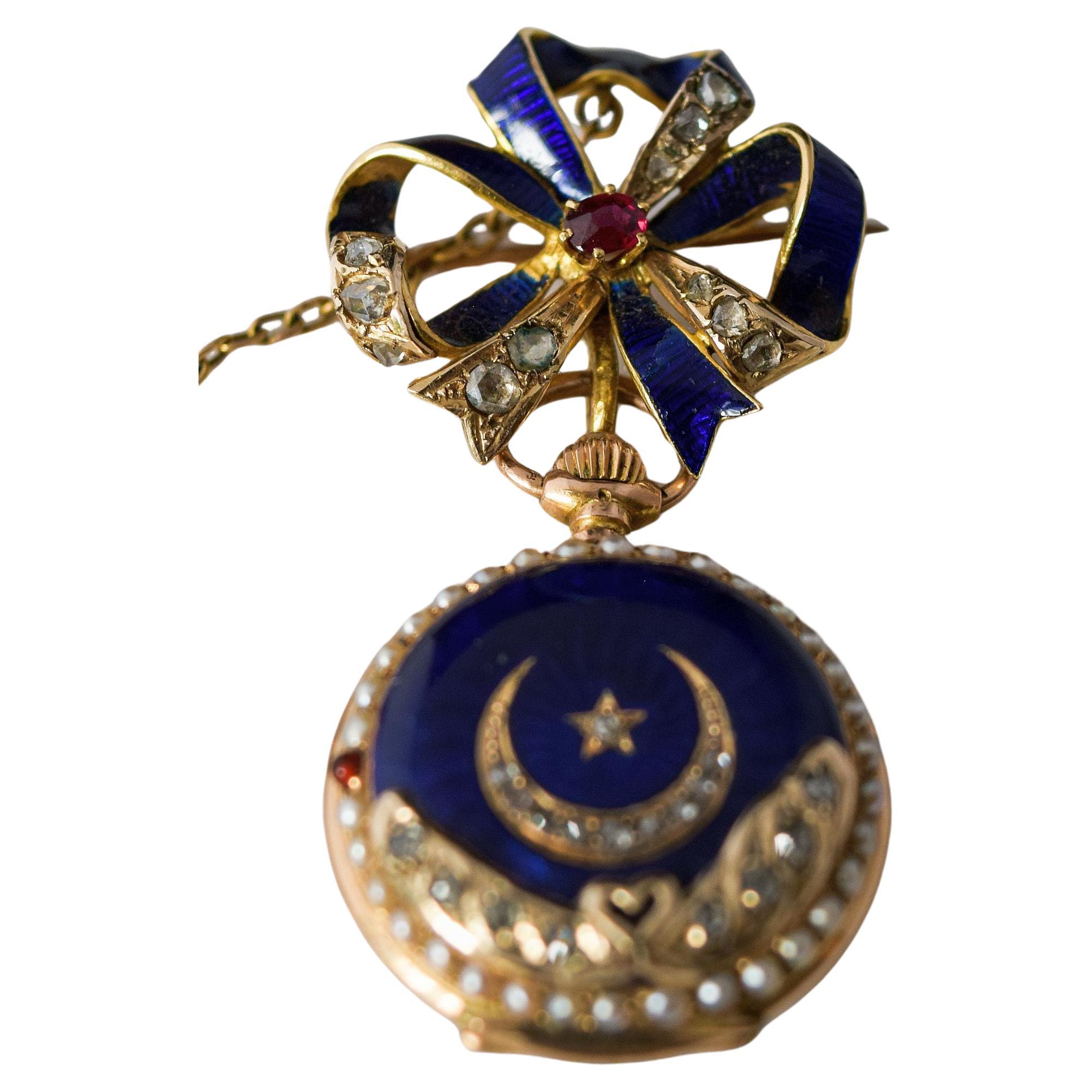 Attractive Enamel and diamond Hunter cased fob watch 18 K
The blue enamel front of the watch has a moon and a crown set with diamonds.
Below section of the front has further inlaid diamonds with a little gold heart where
diamonds meet from both