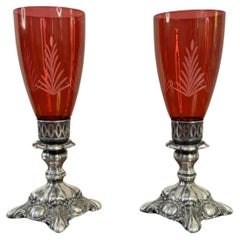 Attractive pair of antique ruby glass and silver plated candle holders