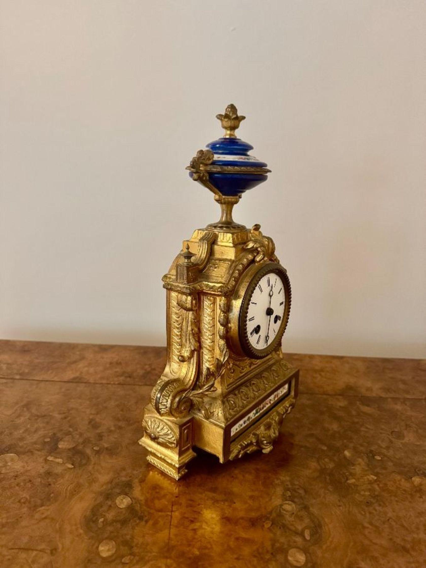 Attractive quality antique 19th century French ormolu mantle clock, having a fine quality antique 19th century French ornate gilt mantle clock with beautiful ornate detailing with acanthus leaf motifs and scrollwork with a porcelain floral panel to