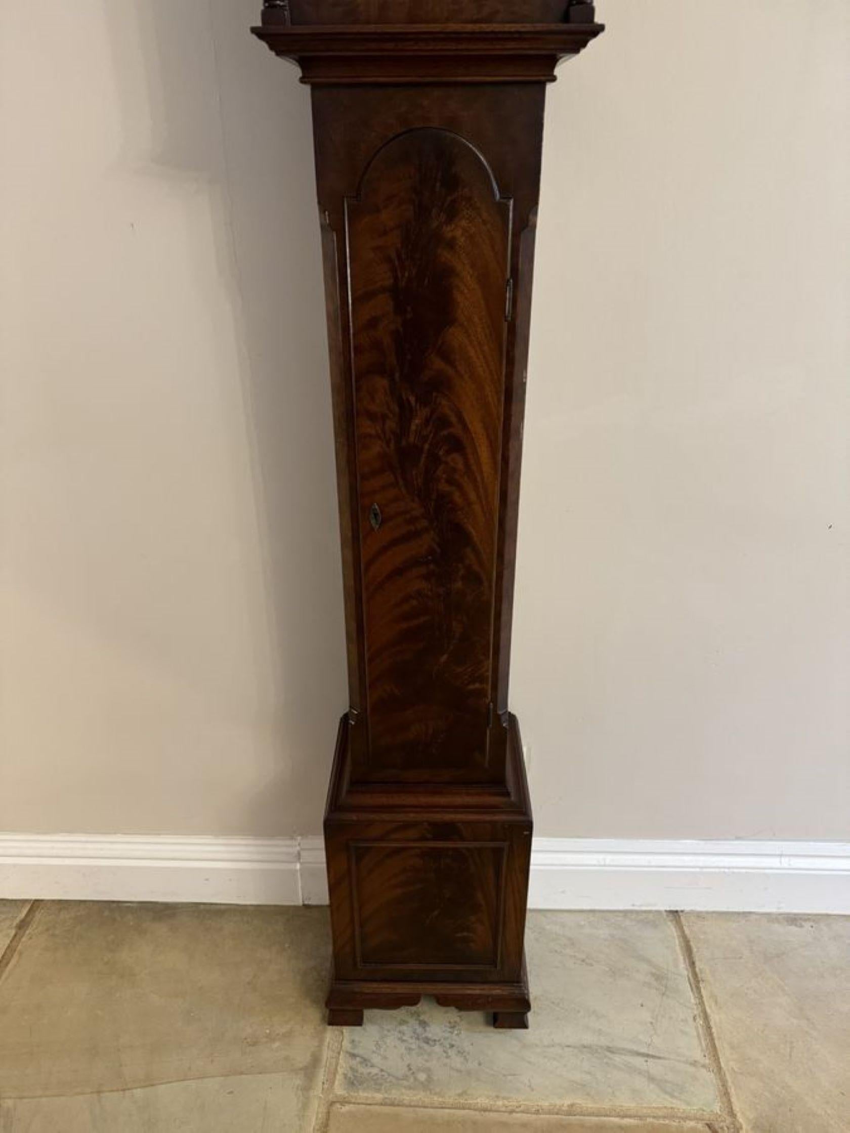 Attractive quality antique mahogany chiming grandmother clock, having a quality antique early 20th Century mahogany cased grandmother clock with a twin swan neck pediment, the arched glass door enclosing a 6.5 brass and silvered dial with the