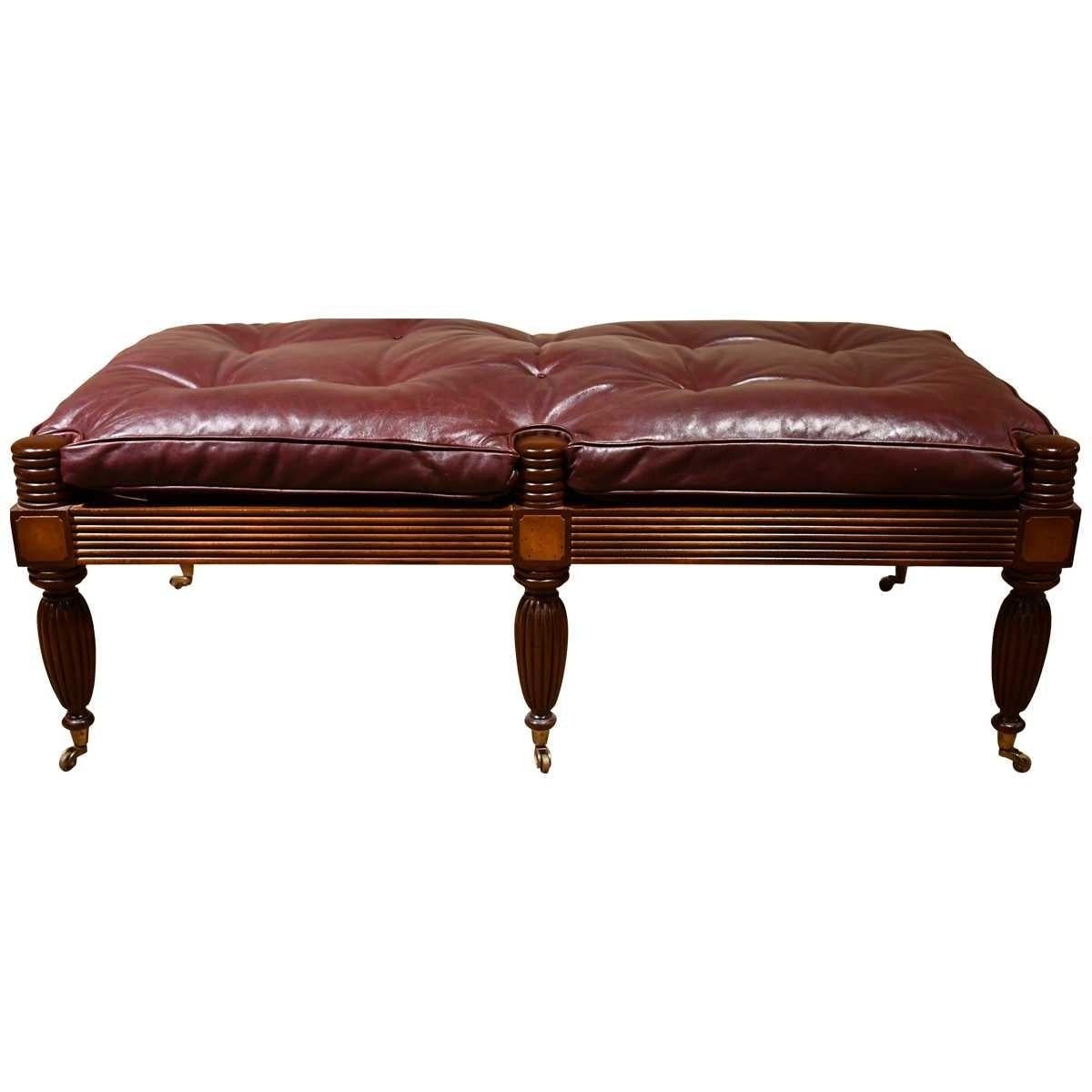 This handsome well made Regency style Mahogany bench is ideal in a foyer, mudroom, the foot of a bed or used as a coffee table in a den. The seat rail is reeded along with the six turned legs; each topped with a contrasting burl inlay and terminated