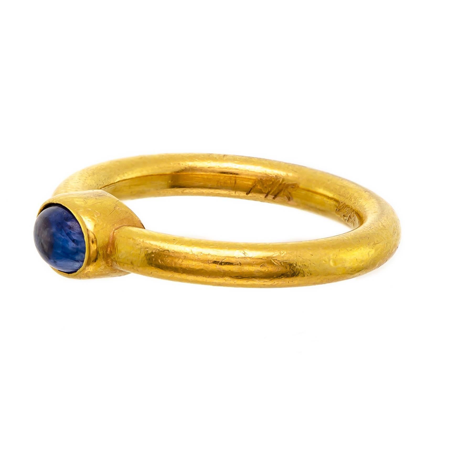 Attractive tailored 22 karat and cabochon sapphire ring centrally bezel set cabochon sapphire brushed finish 22 karat mount - current ring size 5.5 + -hallmarked shank Very good condition - Great look

Cabochon approx 3/8 inch across - petite sized