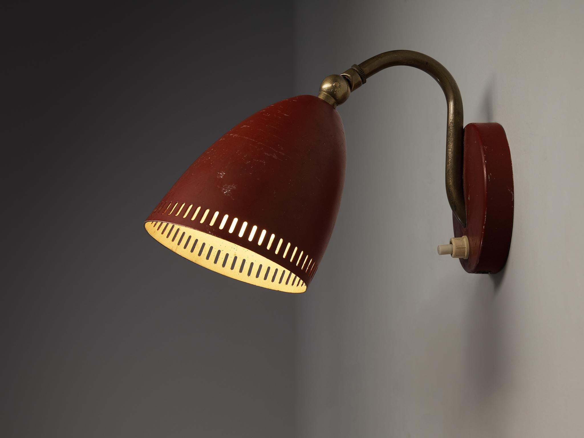 Wall light, metal, brass, Europe, 1950s

A wall light with red lacquered metal shade and base. The stem of this elegant light is executed in brass. A nice detail of this design are the small perforated rectangular cutouts near the outer rim of the