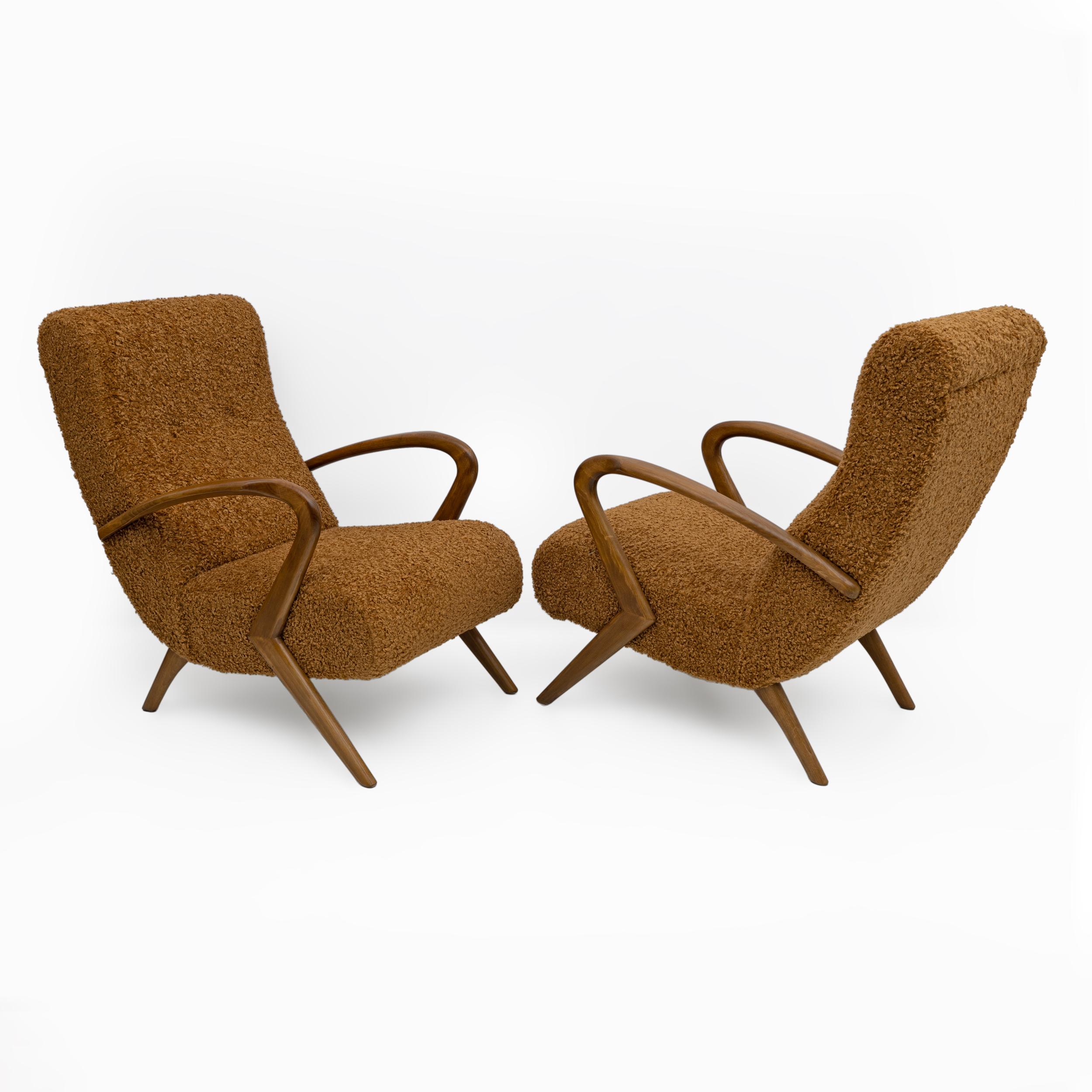 This pair of Italian armchairs captures the essence of mid-20th century modern design, attributed to Paolo Buffa. Made around the 1950s, these armchairs are distinguished by their elegance and refinement. The armchairs have been restored and