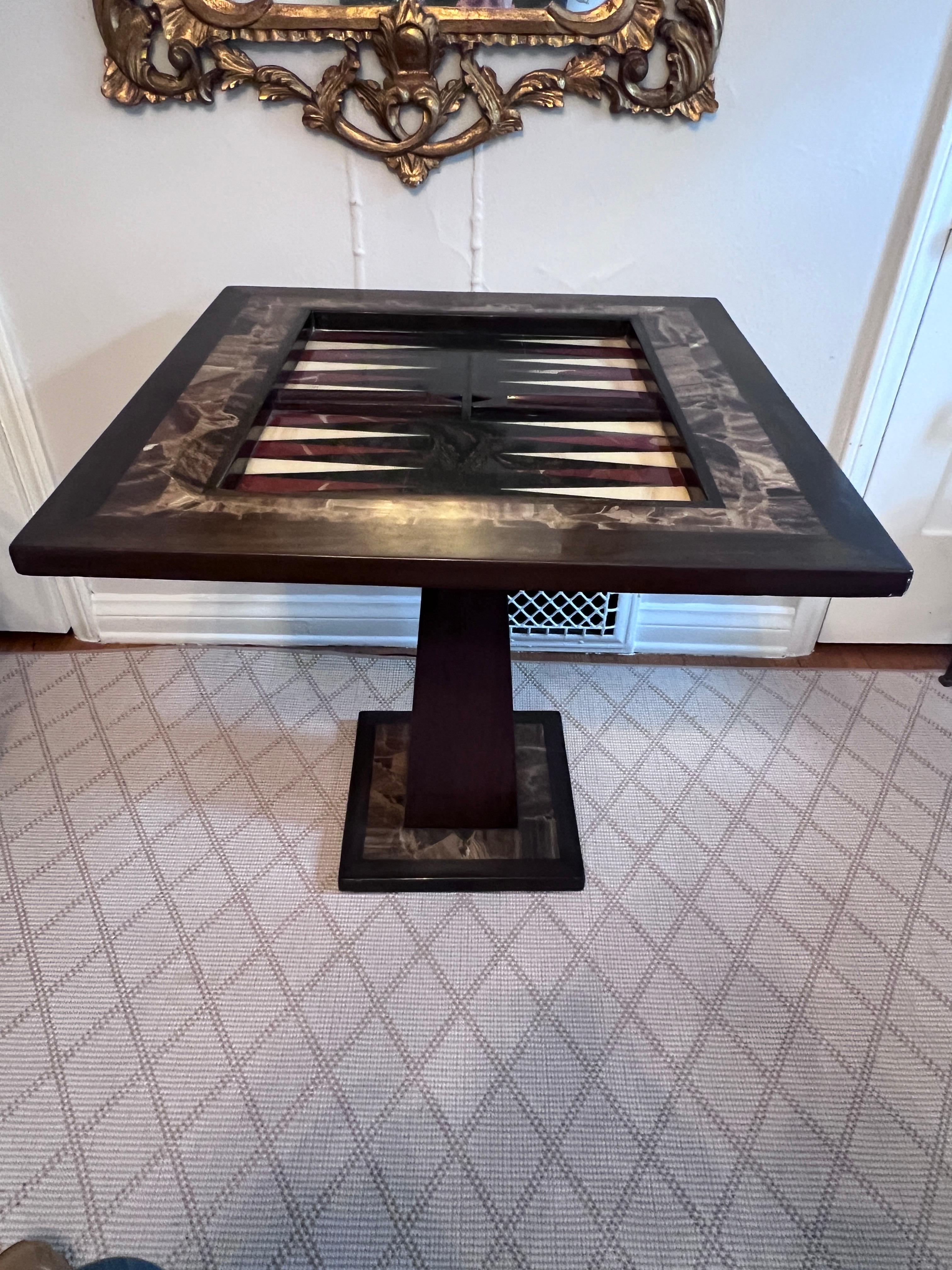 Attributed to Arturo Pani, an Onyx game board with a Walnut surround on top and at the base.  The Table can be a solid Onyx side or center table and hold books, a lamp, and decorative accessories.

When the Onyx top is Flipped it becomes a checker
