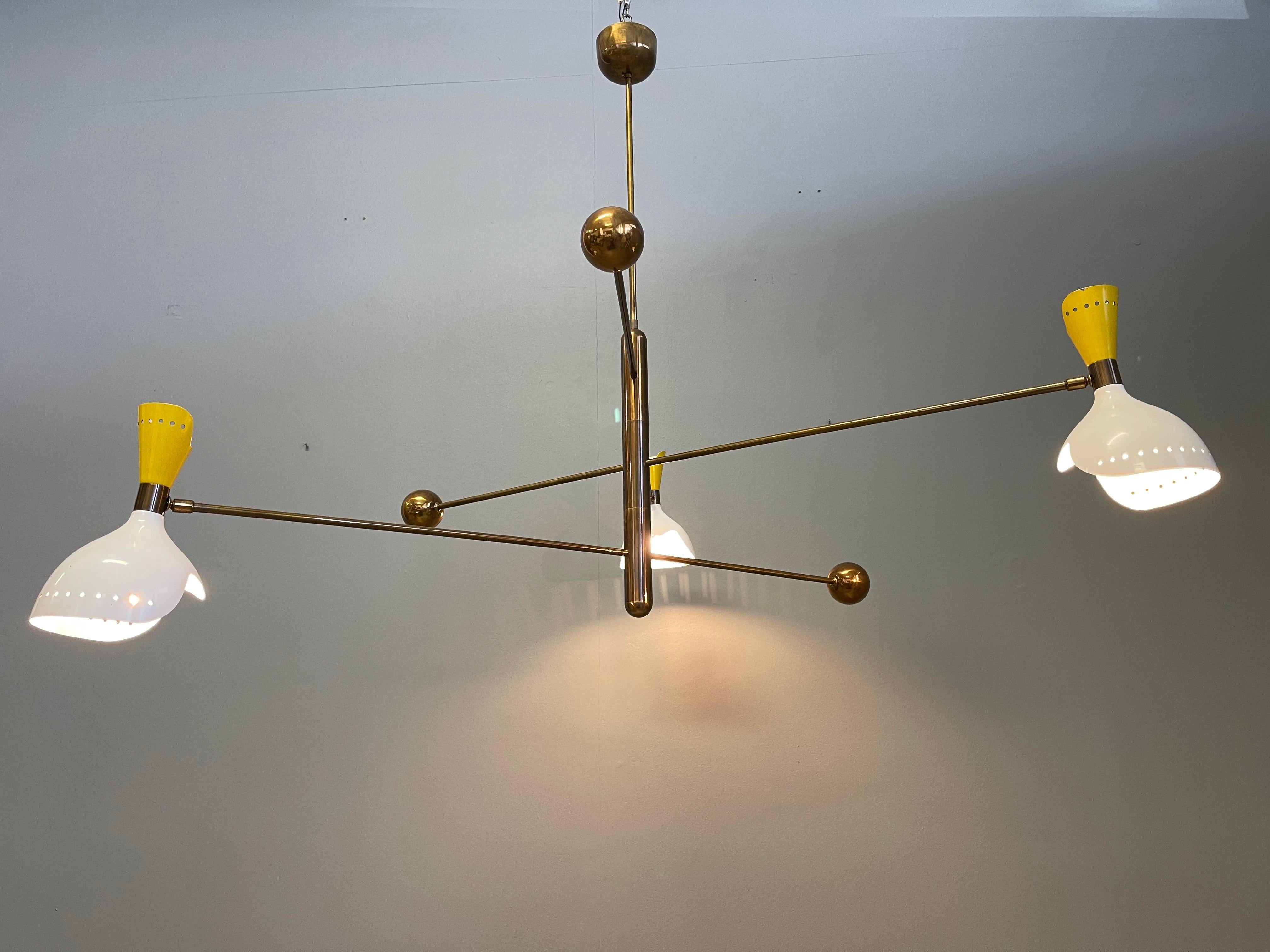 Fantastic rare chandelier attributed Stilnovo. Composed of three adjustable arms with counter weight. Made of brass and metal lampshades.