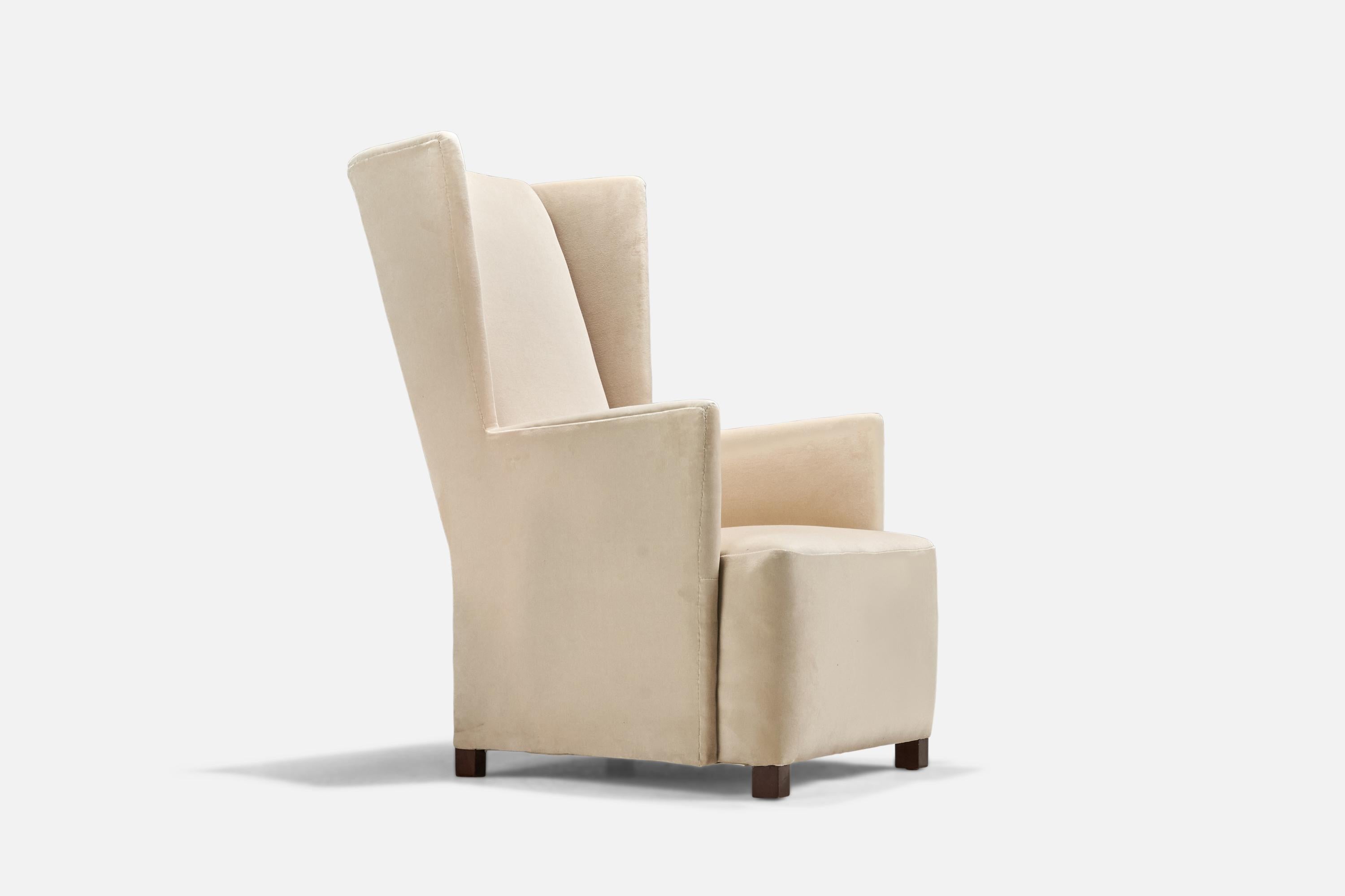 A modernist velvet and birch lounge chair designed by Bjorn Tragardh and Uno Åhren and produced by Svenskt Tenn, Sweden, 1930s.