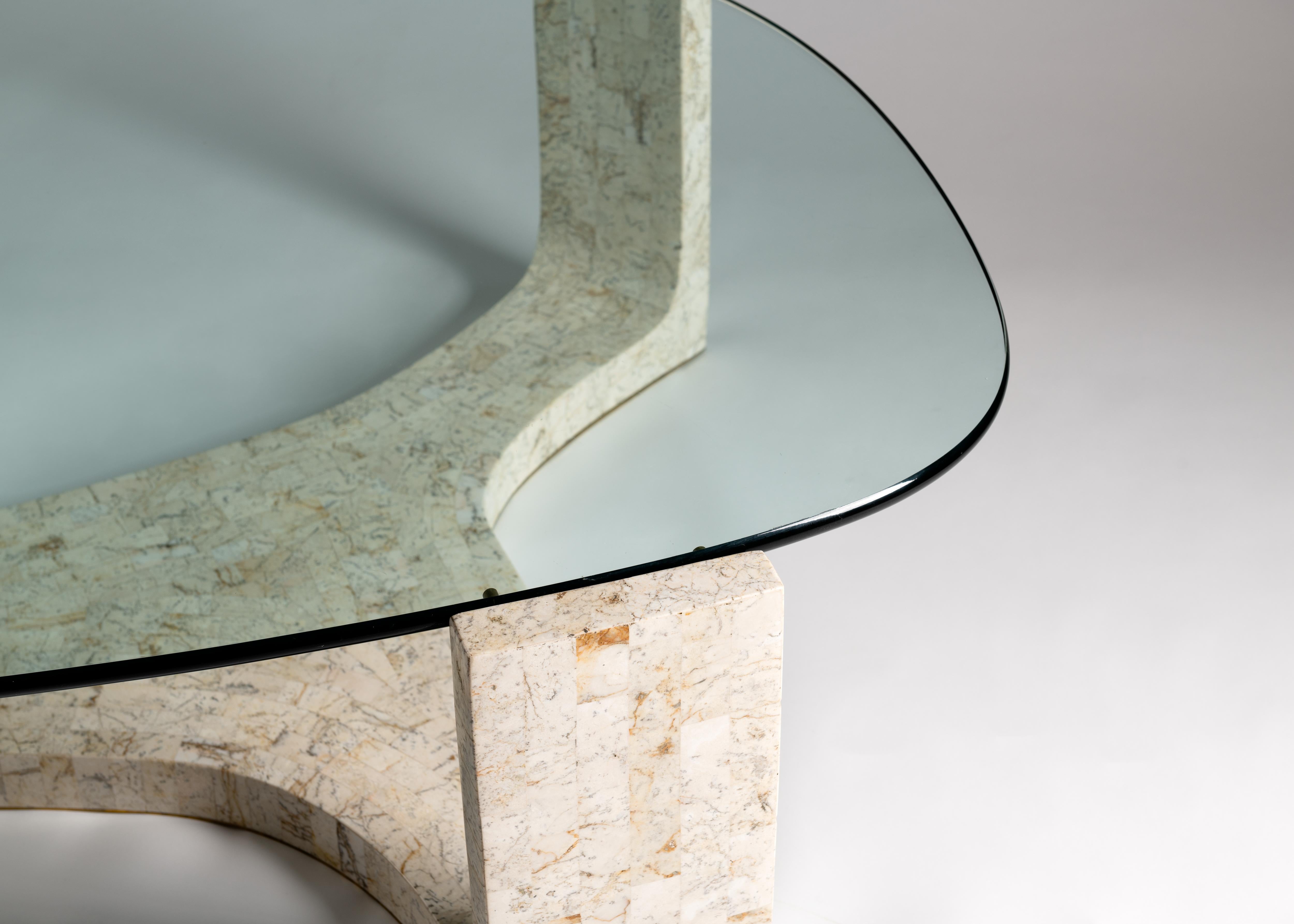 This marvelously amorphous table of glass and off-white veneer is not merely striking--it's remarkable for how little visual space it consumes despite its ample, practical size.

  