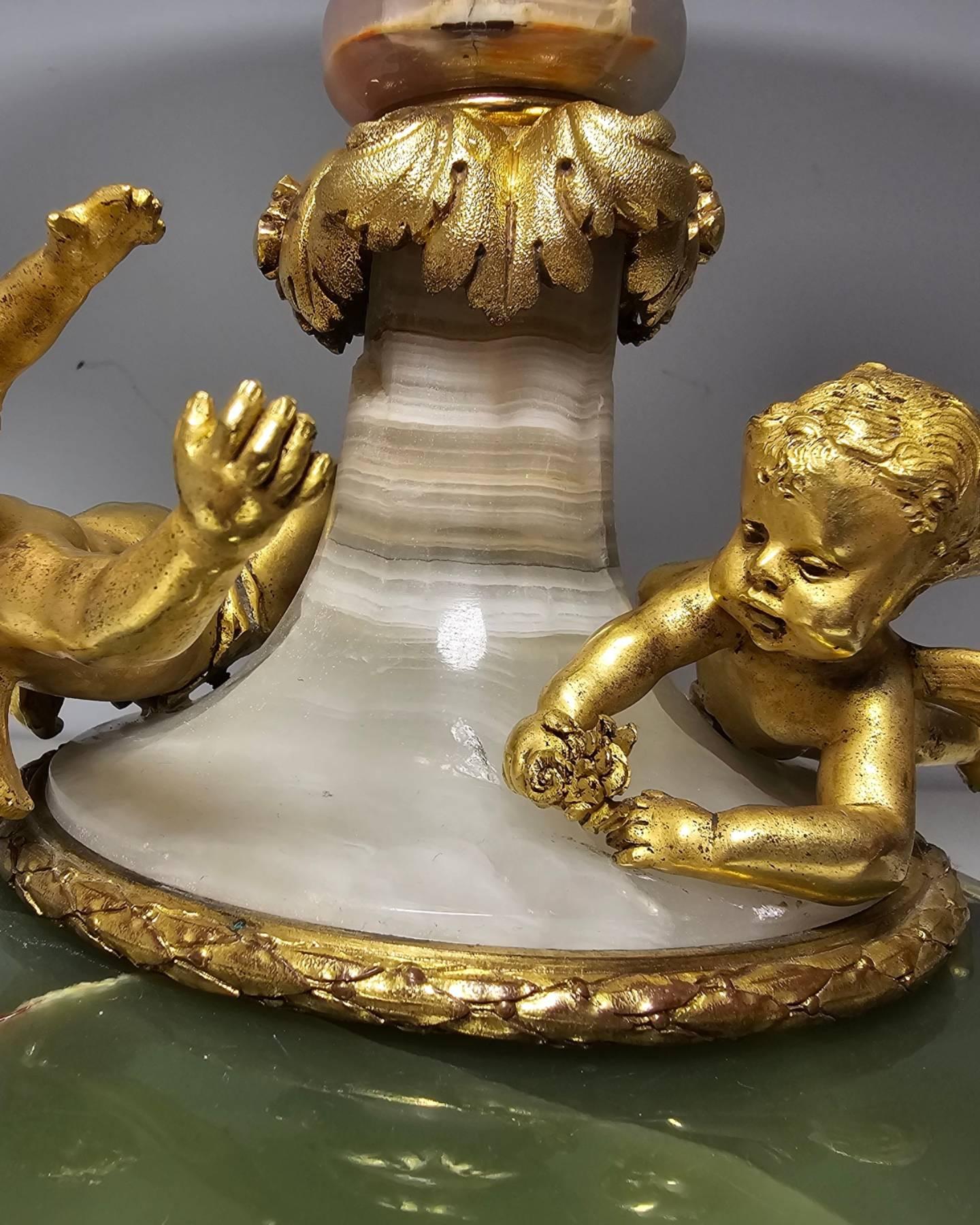 Attributed To Eugène Cornu, gilded bronze  agate Et Onyx d'Algérie, centerpiece 
A French elegant 19th century gilt bronze agate and onyx cente dish with two gilded bronze  cherubs.
The two  cherubs playing around the dish, with several specimen of