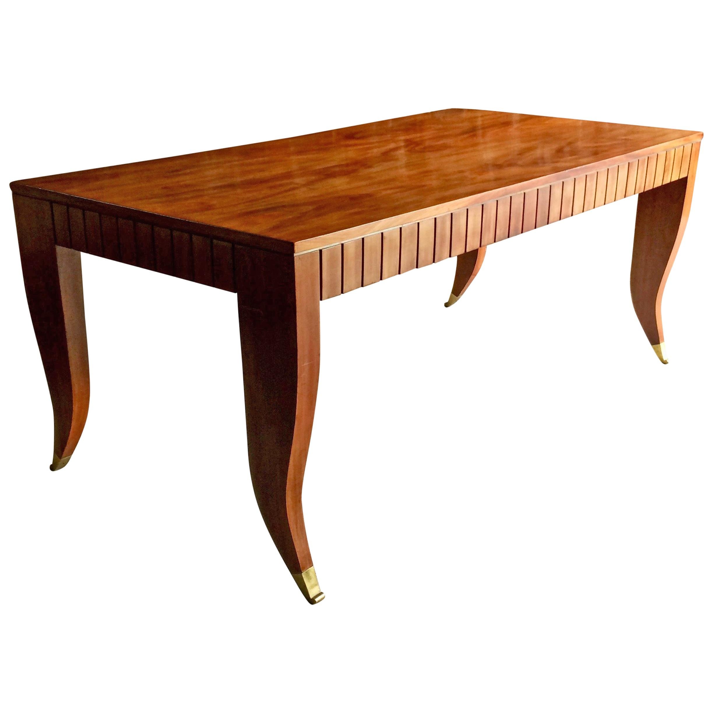 Extremely rare midcentury Gio Ponti (attirubuted to by Sotheby's) flamed mahogany dining table or desk circa 1940, the rectangular flamed mahogany top with fluted frieze raised on shaped legs with gilt bronze sabots.

Provenance: lot 148, Gordon