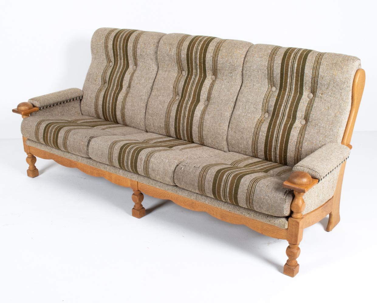 This unique and utterly cool sofa by Henning Kjærnulf would be a stunning addition to a California Ranch or Bungalow-style home! The design consists of a Spanish Mission-inspired silhouette reimagined in gorgeous quarter-sawn white oak, with playful