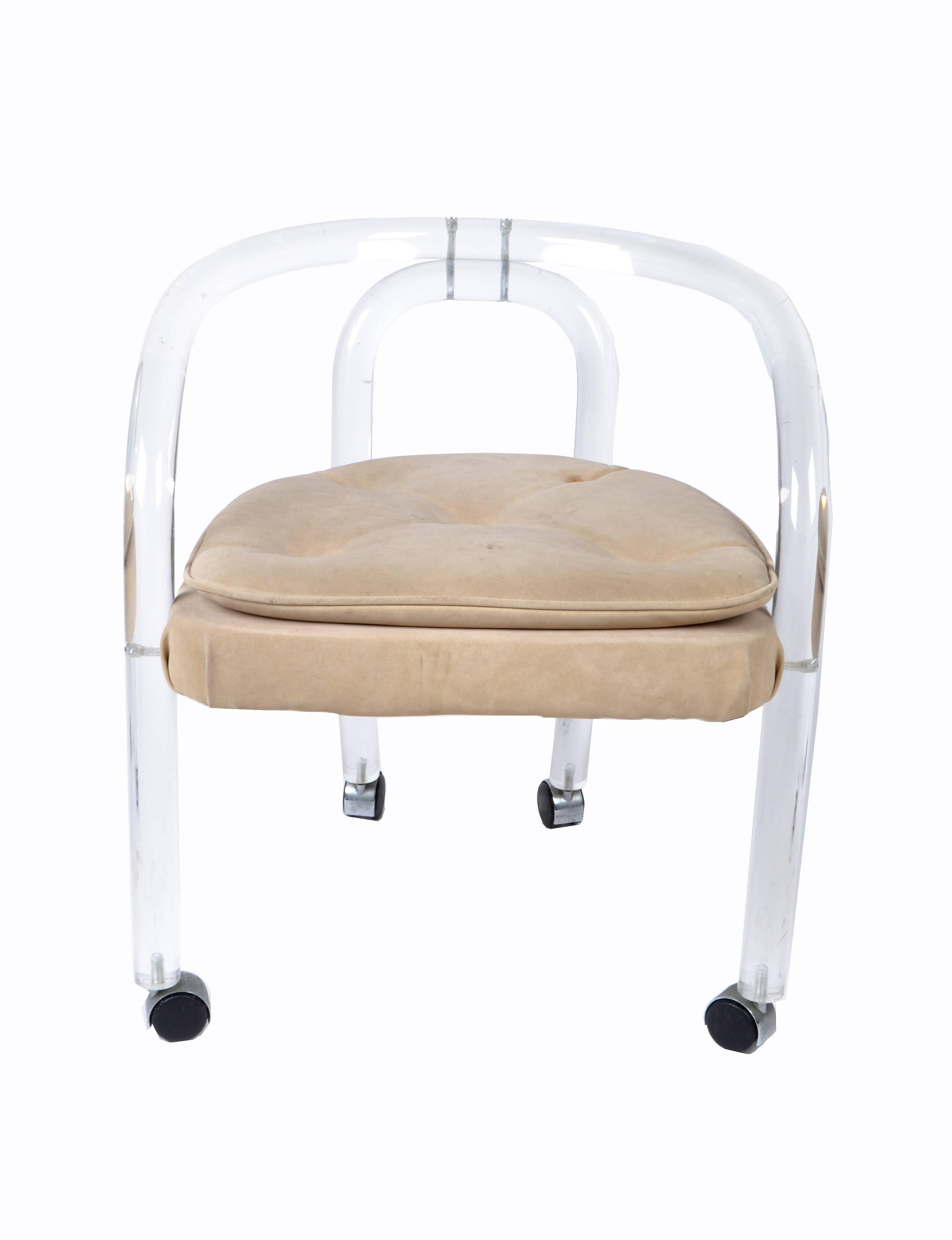 Mid-Century Modern armchair in Lucite with upholstered seat attributed to Leon Frost.
The Lucite chair is on casters and can be perfectly used as a desk chair or a vanity chair.
Classic design simply lovely.  

Measure: Seat height 18 inches.