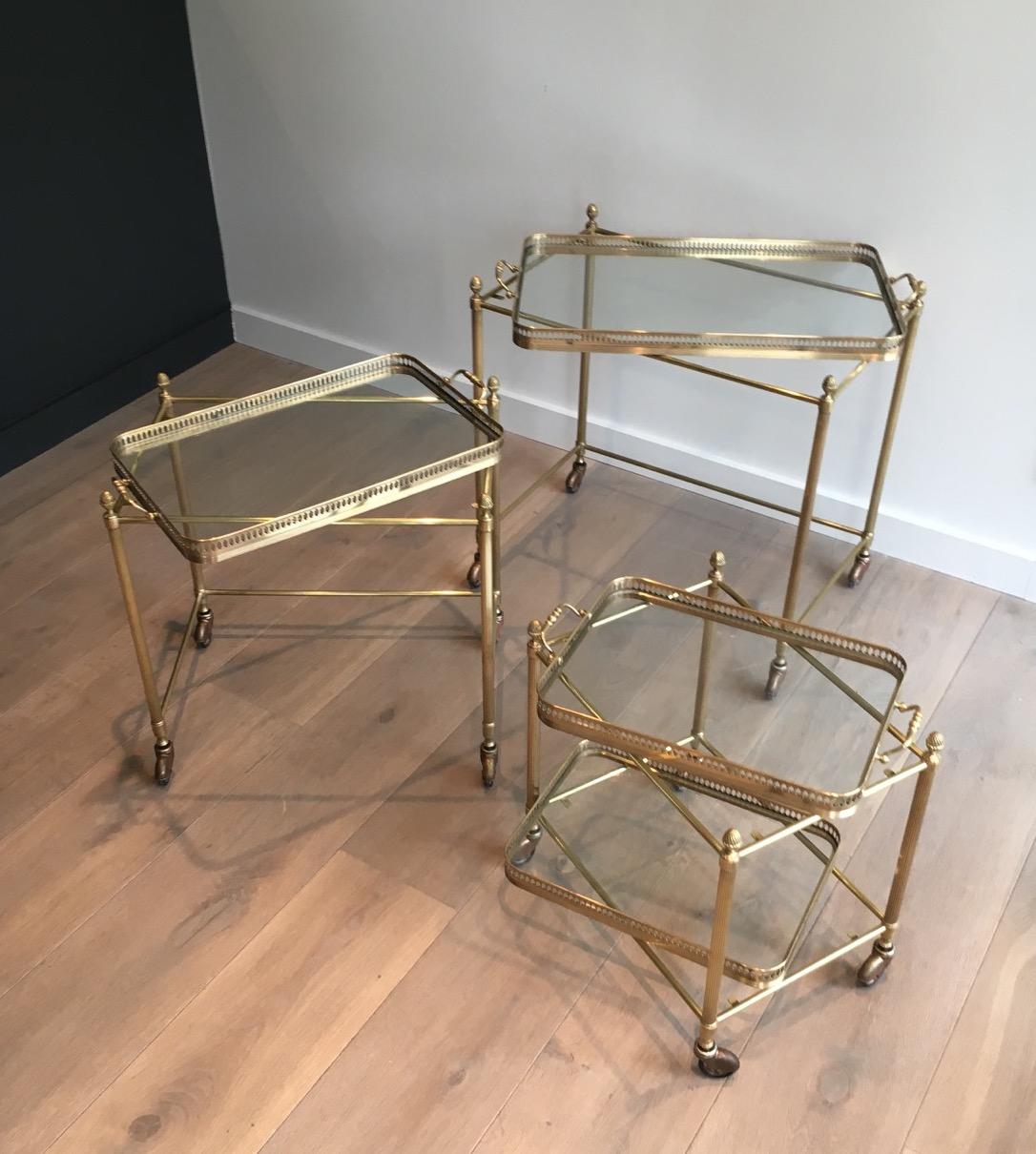 French Attributed to Maison Baguès, Set of Neoclassical Brass Nesting Tables on Casters