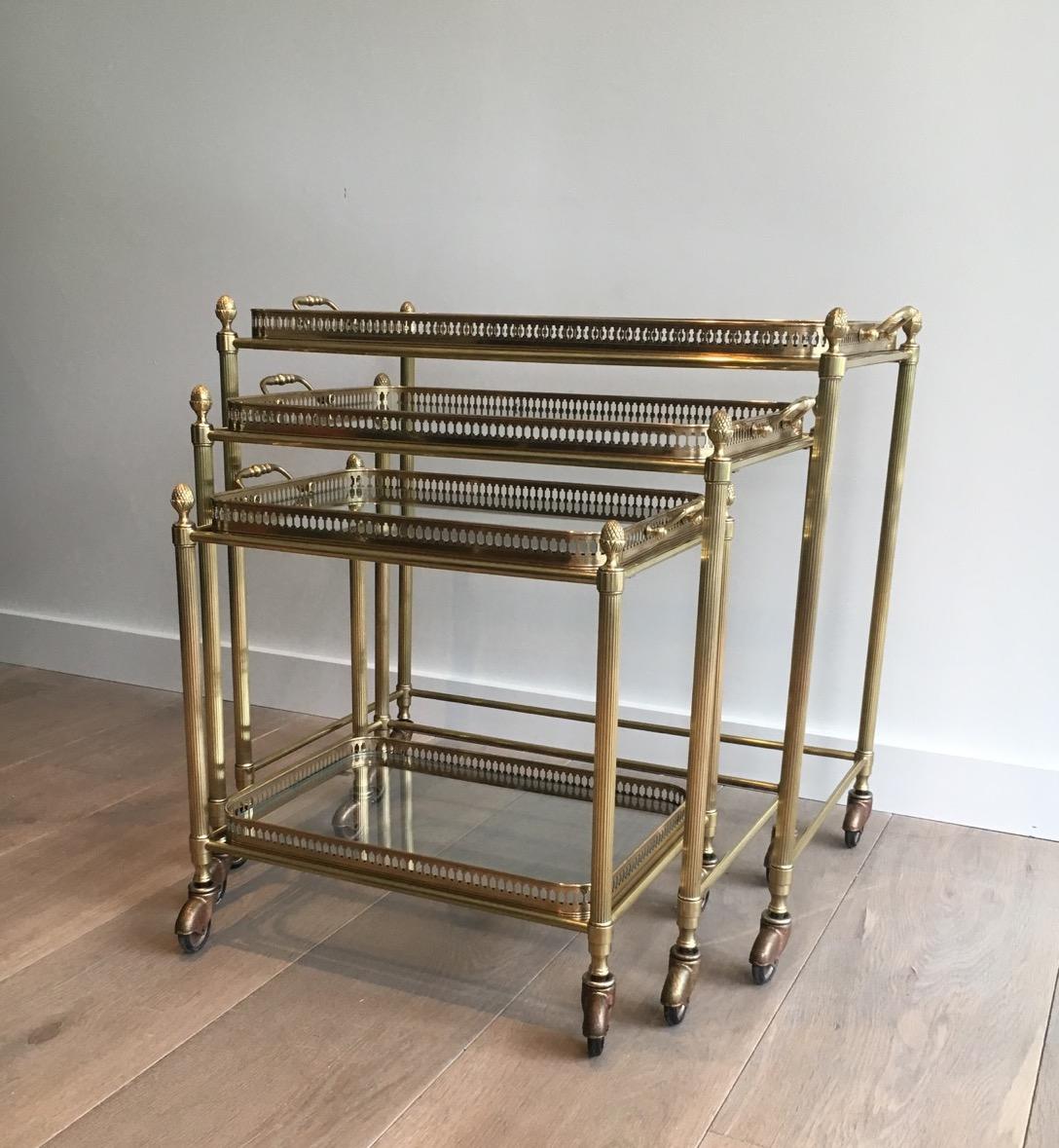 Mid-20th Century Attributed to Maison Baguès, Set of Neoclassical Brass Nesting Tables on Casters