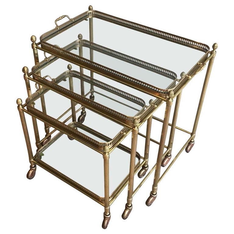 Attributed to Maison Baguès, Set of Neoclassical Brass Nesting Tables on Casters For Sale