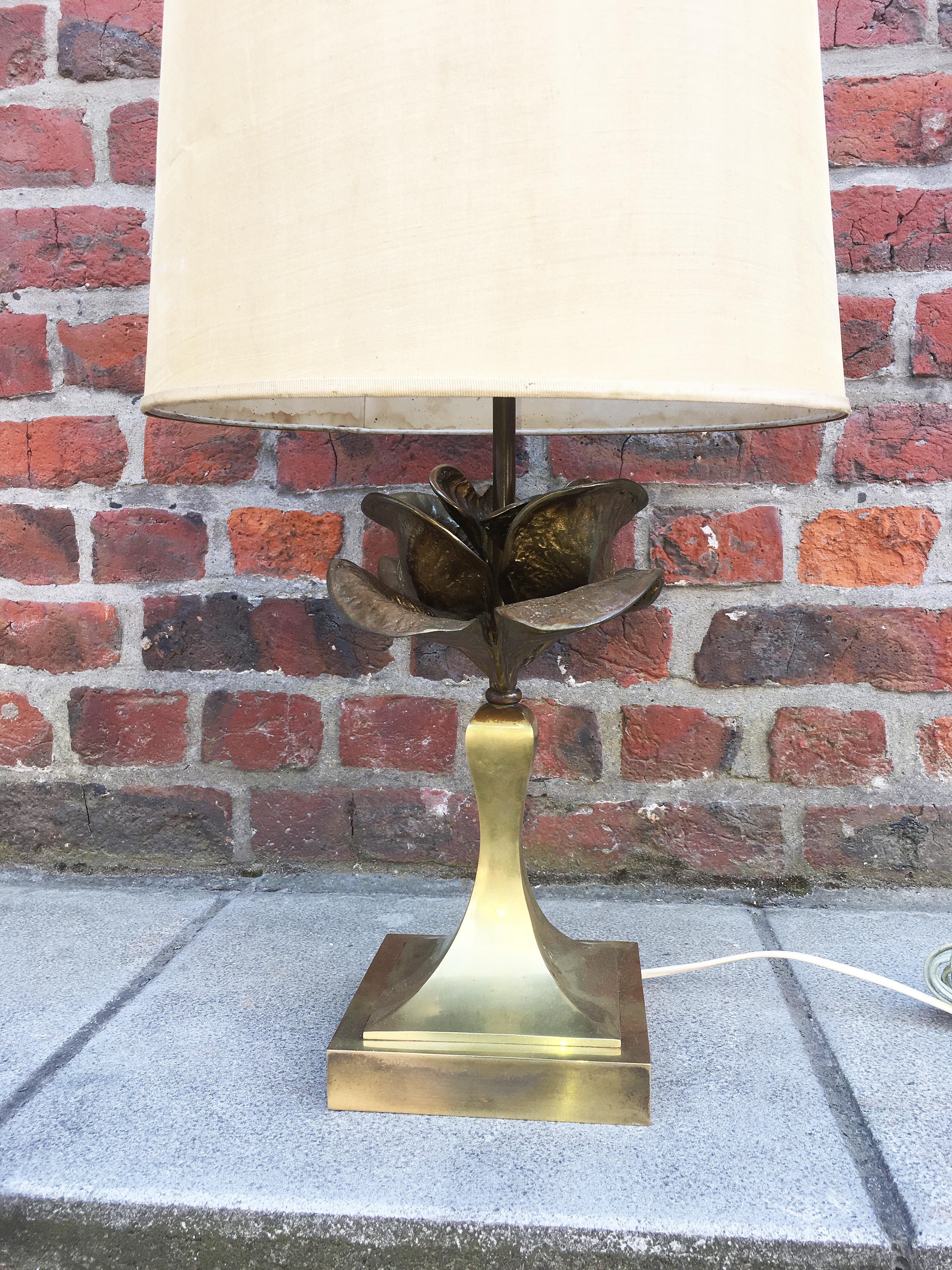 Attributed to Maison Charles, gilt metal table lamp.
The lampshade is in poor condition
 Shade to restored.