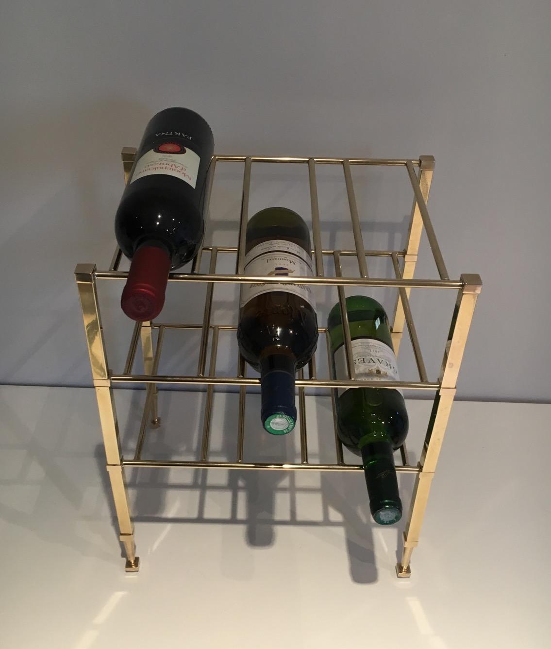 This elegant neoclassical wine bottles rack is made of brass. It is attributed to the famous French designer Maison Jansen. Circa 1940.