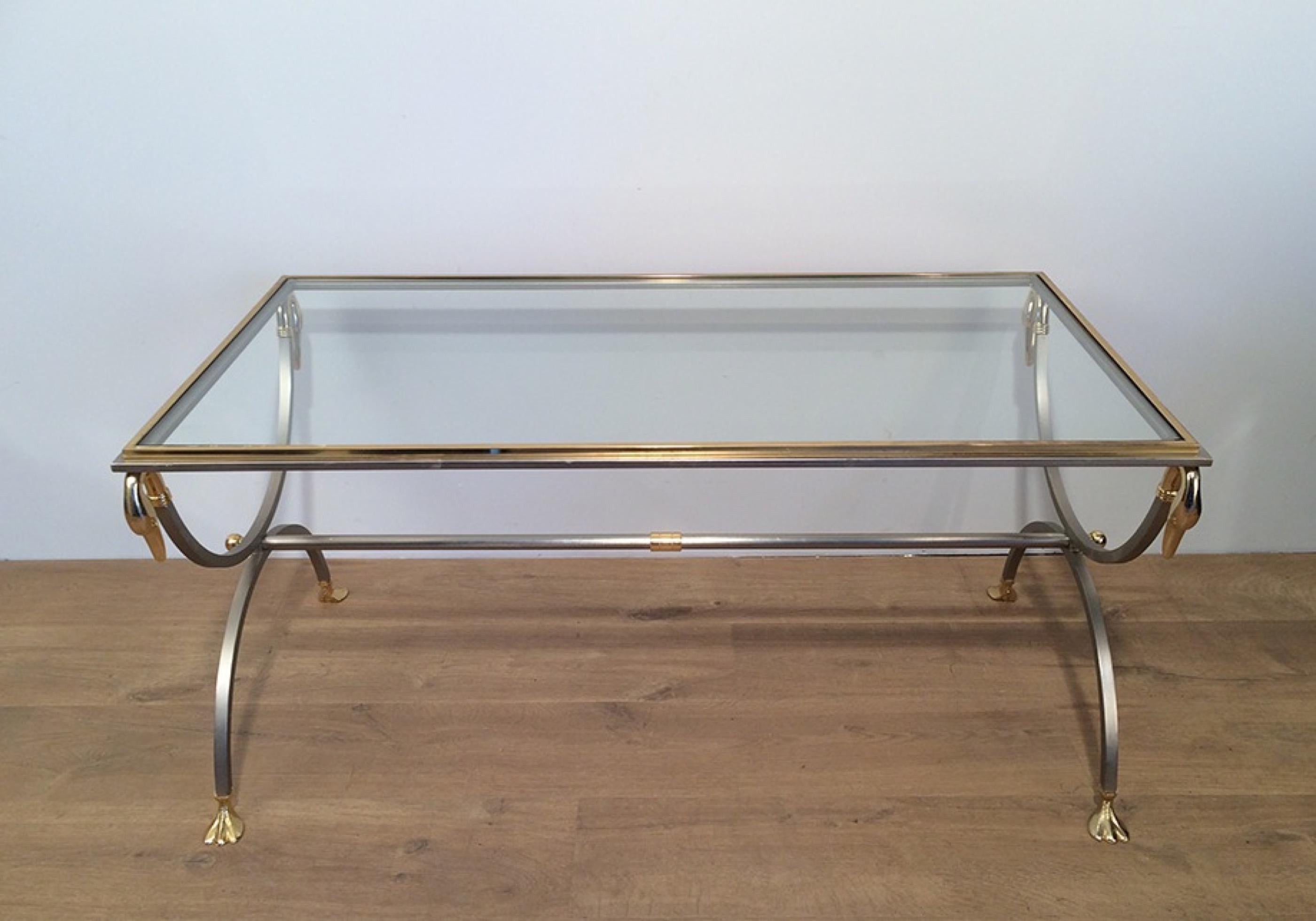 This beautiful coffee table with swanheads and feet is made of brushed steel and brass. This is a French design and a nice work of very good quality, circa 1970.