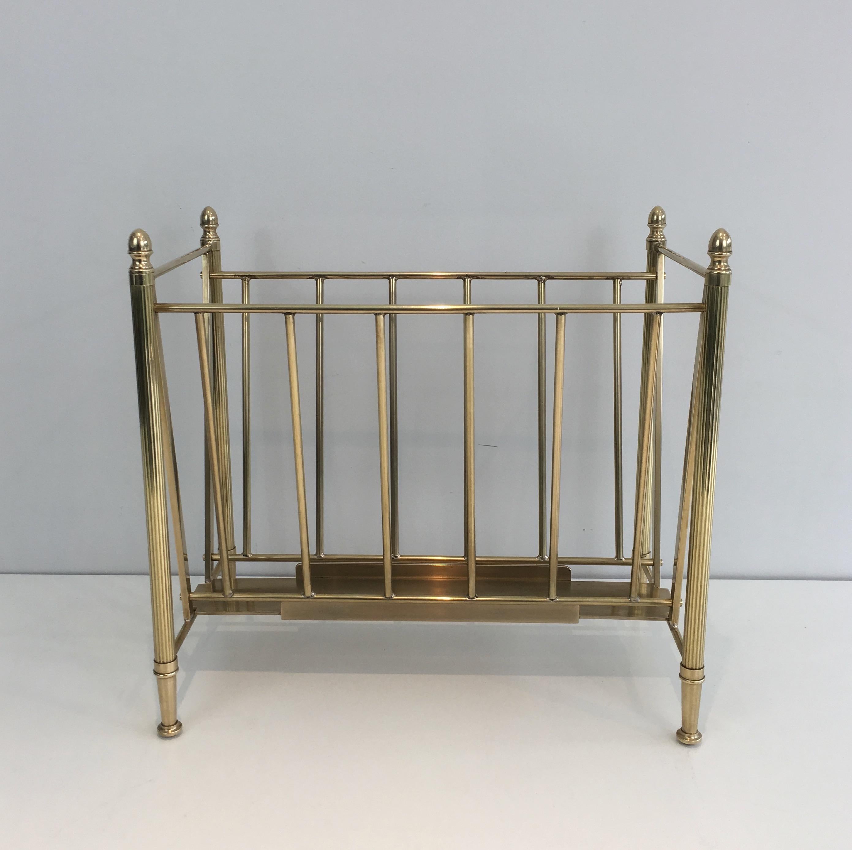 This nice neoclassical magazine rack is made of brass. This is a very nice model which quality is really good. This is a French work, attributed to famous French designer Maison Jansen, circa 1940.
