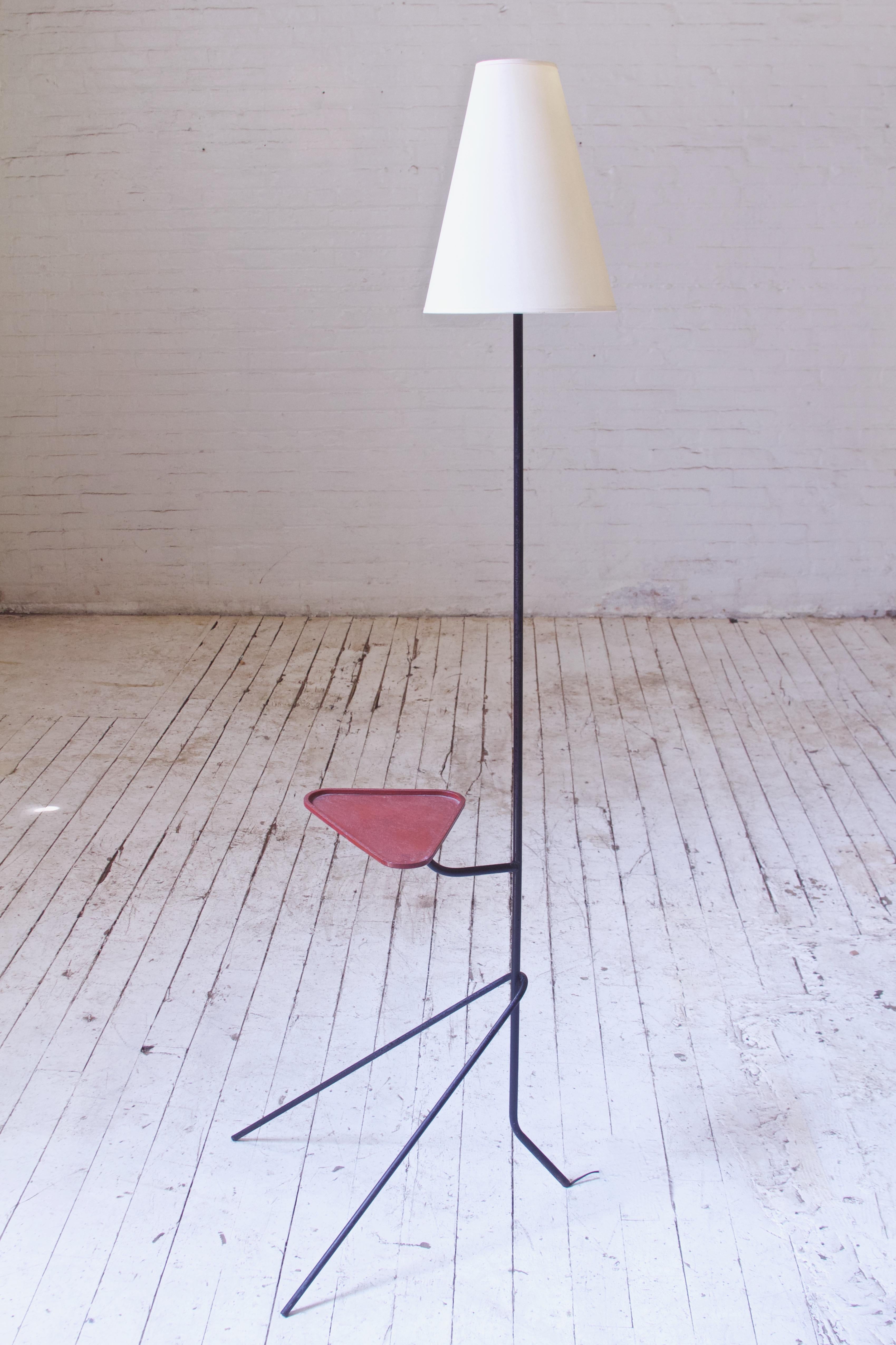 Vintage Mathieu Matégot floor lamp with adjustable tray in lacquered metal with original finish, bulb, and lampshade. Playful composition to this piece, structurally sound with a great uniform patination and original brass hardware present and