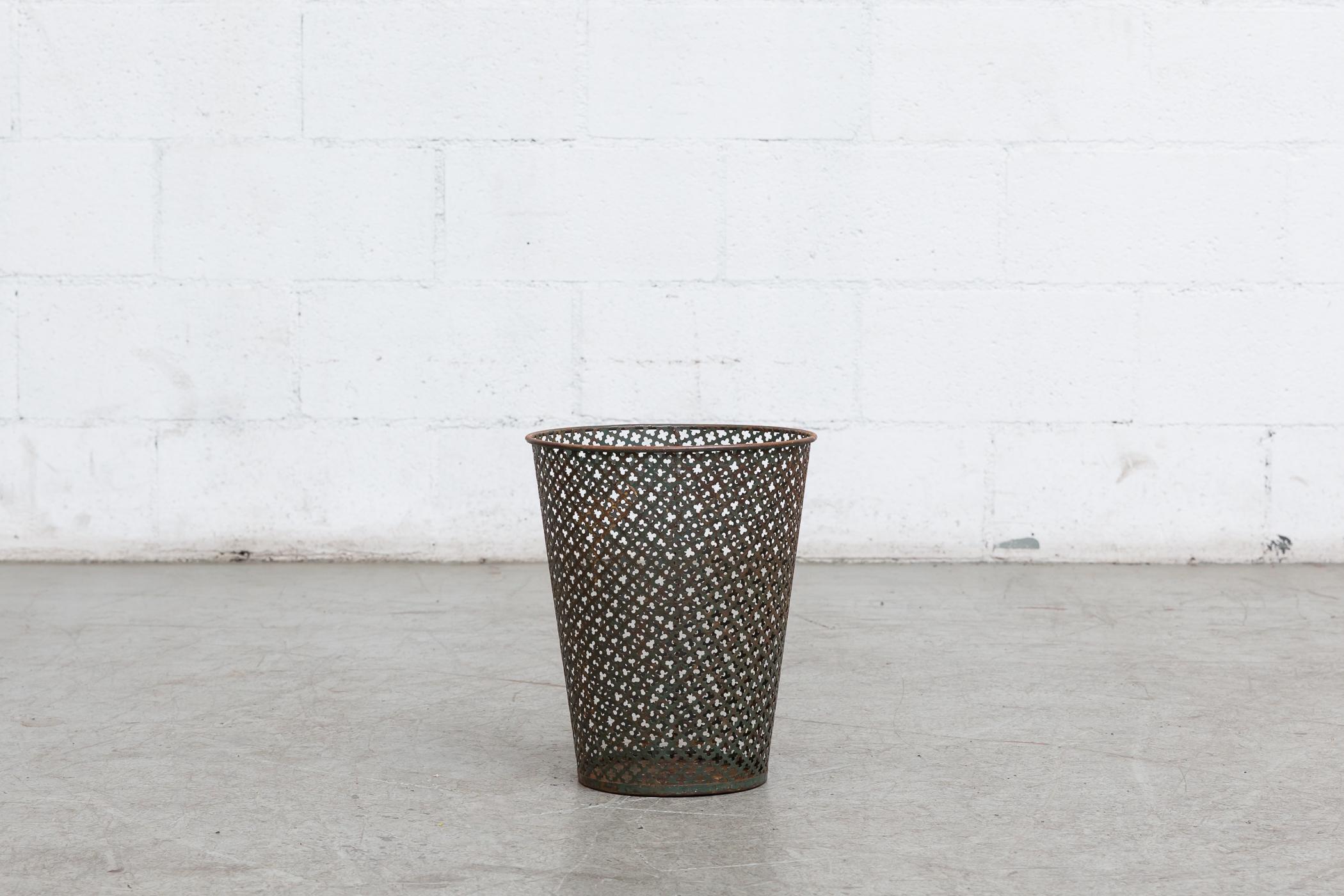 Attributed to Mathieu Matégot waste basket manufactured by Artimeta, Netherlands. Visible wear with visible enamel loss. Beautiful patina. Varying conditions.