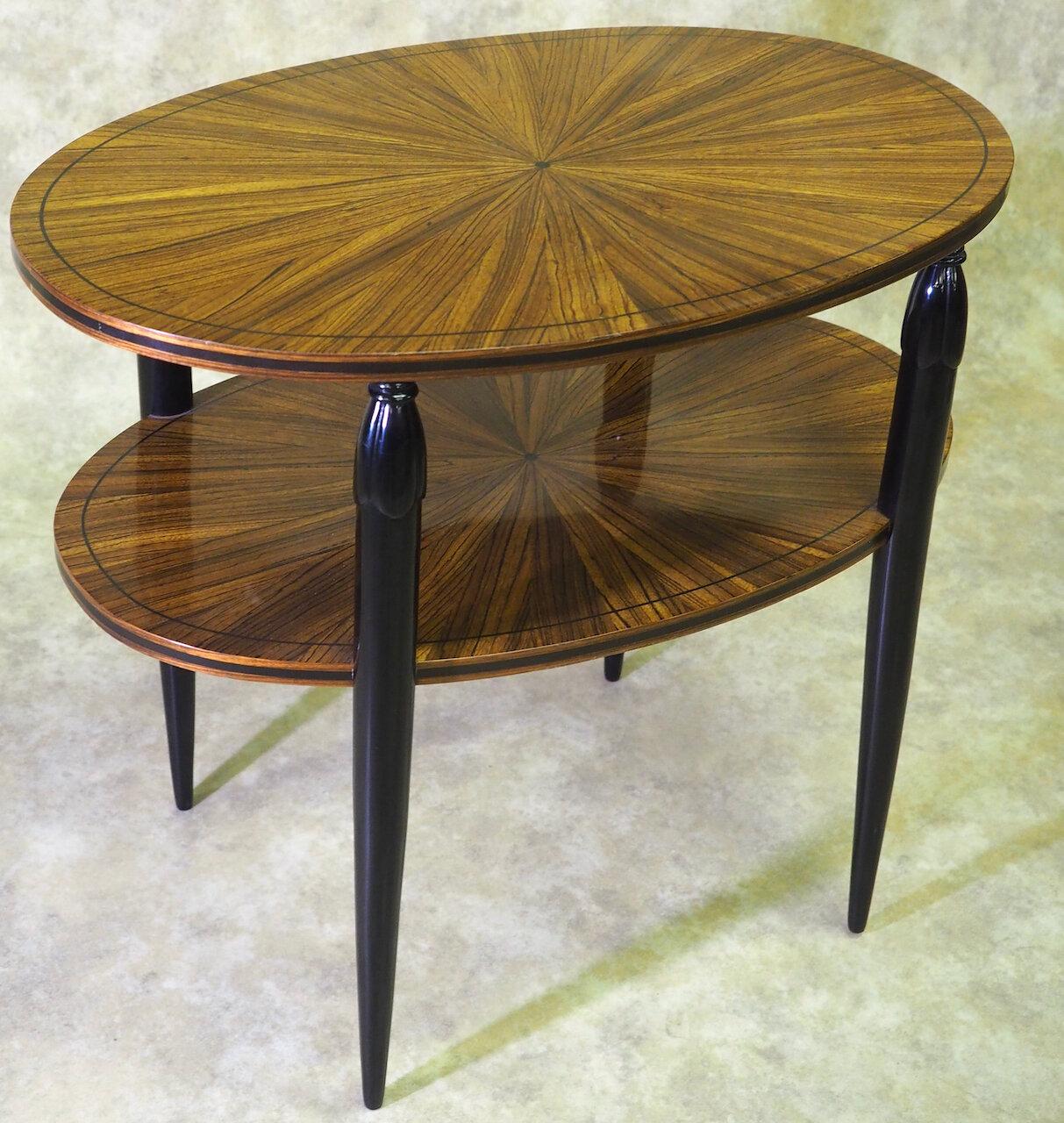 Classic French Art Deco side/end/center table attributed to Maurice Dufrene, circa 1920. Sunburst-pattern top in exotic hardwood with narrow ebonized inlay. Ebonized sculpted legs. 31.5” long x 25” wide x 27” high. Restored and