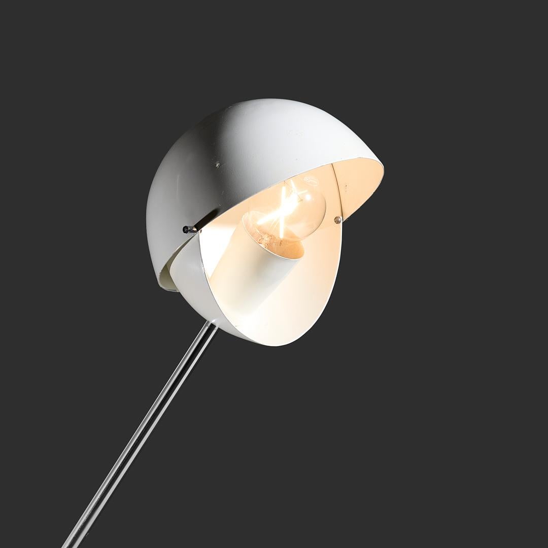 Attributed to Paolo Tilche 3S floor lamp for Sirrah Italy, 1961. This lamp is attributed to as it has an unusual counter weight at the base instead of the more common ball shape. The round shade is adjustable and creates a very nice spherical light