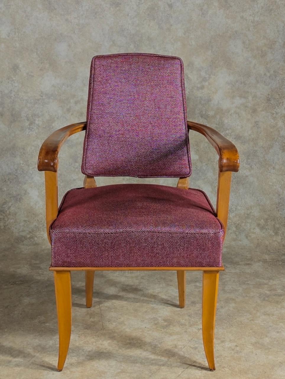 French Art Deco pair of open-sided armchairs attributed to the French designer Pierre Lardin, circa 1937, in cherry. Newly restored and upholstered. 21.5” wide x 24” deep x 32.5” high. Arm height: 26.5”.  Possible variant of chairs documented in
