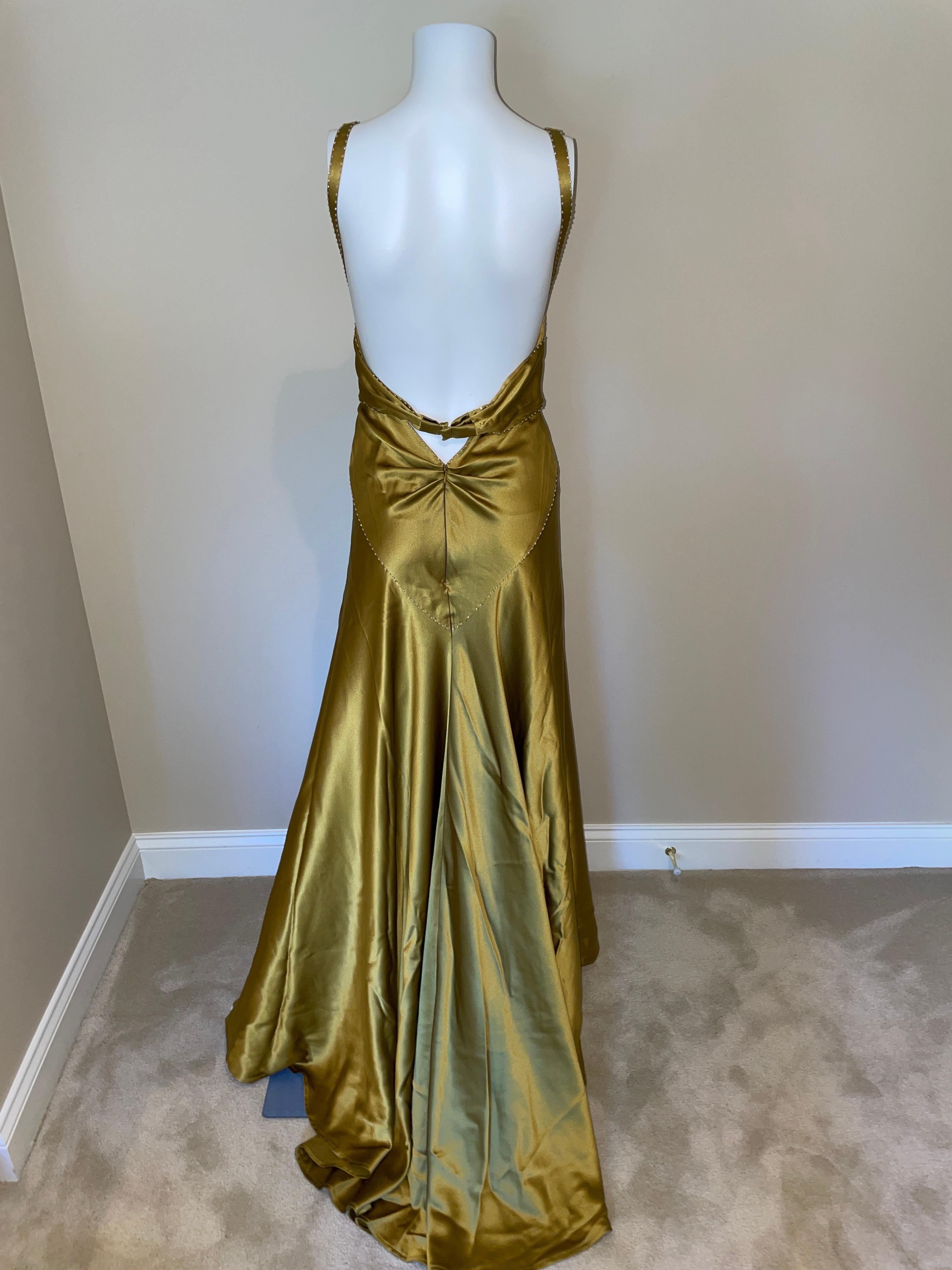 NO TAGS attributed to Roberto Cavalli. I love this maxi dress with train but it’s missing all of its tags. I think it’s silk and I think it will fit a size S/M. There are tiny flaws so if you are picky please do not purchase this gown! The color is