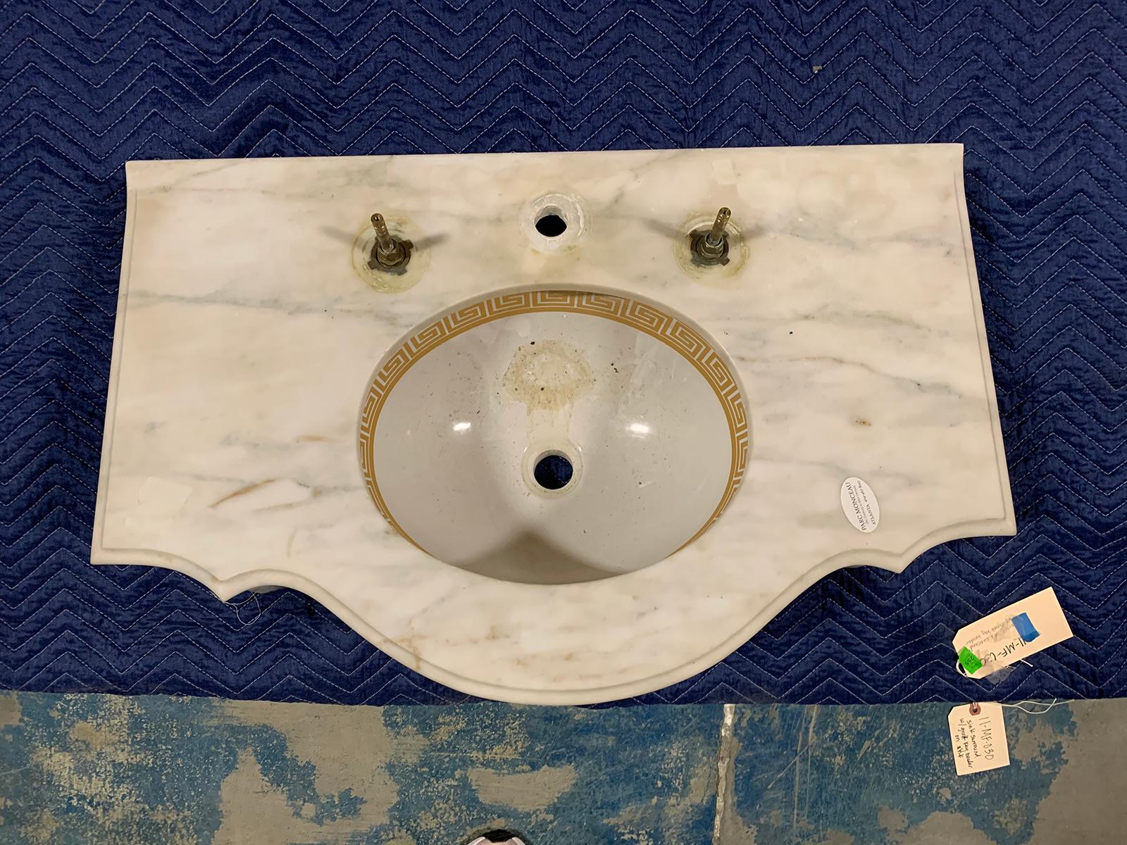 Attributed to Sherle Wagner 20th century circa 1960s marble sink surround with gilt Greek key edging
Has glass legs
Measures: Overall: 32.5” W x 20.5” D x 5” T. The bowl itself measures 14” W x 11” D x 8.75” T.
