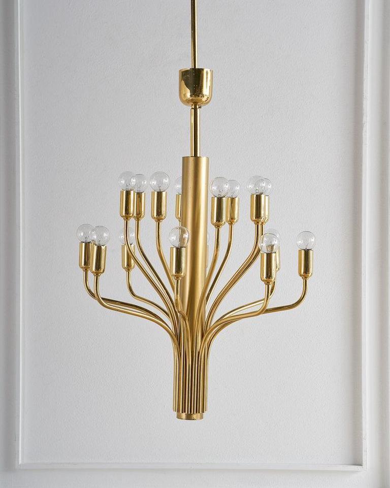 An elegant curved, 16 arm chandelier attributed to German designer Staff Leuchten. Featuring polished and brushed brass, this chandelier has been rewired for U.S use. Accepts standard candelabra bulbs. 

Dimensions: 19.5” diameter x 40.5” height