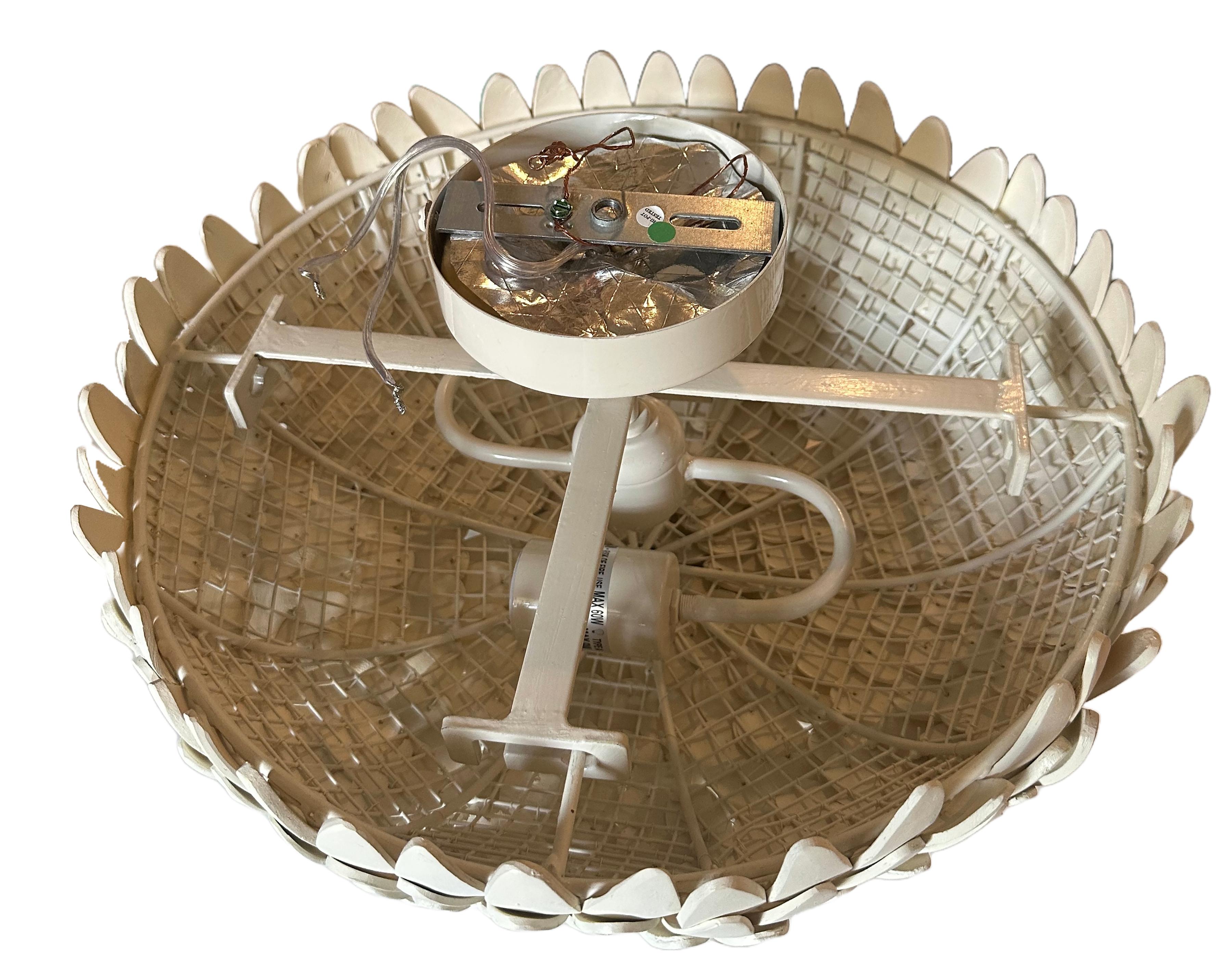 A beautifully crafted Atwater fush mount light fixture. Hand-carved and hand-strung coconut shells on a white powder-coated iron frame. A refined display of artisanal craftsmanship and organic texture. 21st century made. Two of three available in
