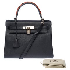 "Au Galop" limited edition Hermes Kelly 28 handbag strap in blue leather, SHW