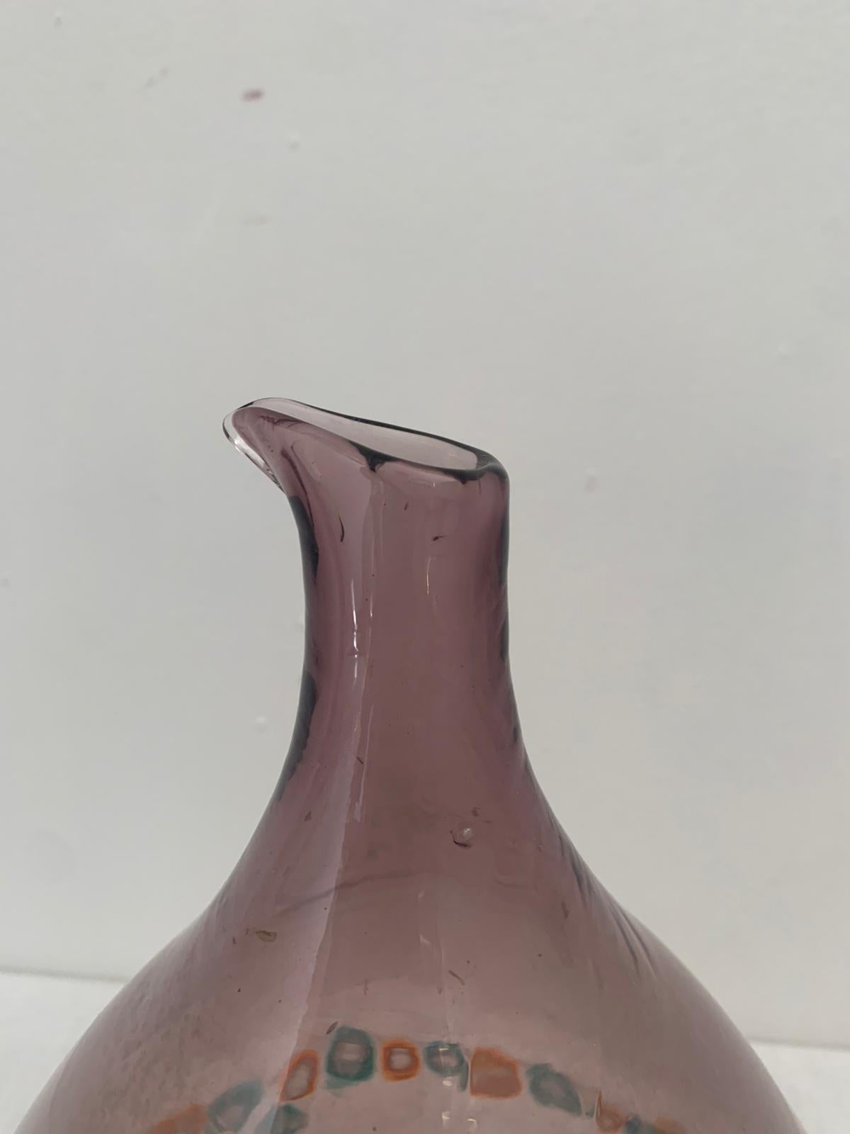 Eggplant-colored blown glass truncated cone vase with murrine band. This vintage piece is in near original condition. Marc Heiremans, Art Glass from Murano, Arnoldsche ed. 1993, page 251.
Packaging with bubble wrap and cardboard boxes is included.