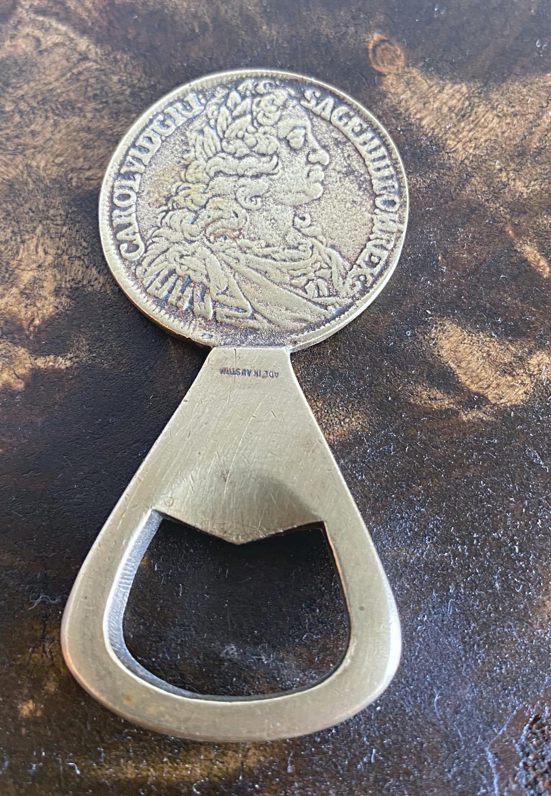 Beautiful Auböck coin bottle opener in solid brass, made by Werkstätten Carl Auböck in 1950s. The casting is very fine because this is an earlier opener. The opener is a copy of the famous Imperator Carolus VI coin.

  