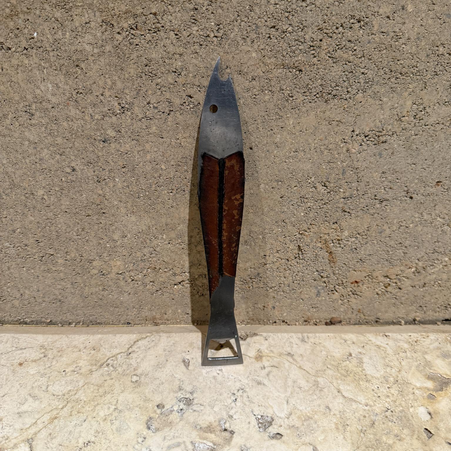 For your consideration, a Carl Aubock bottle opener. Fish shape with leather handle. Stamped AS. Stainless Steel, MADE IN AUSTRIA. (Arthur Salm) 
Stainless steel and leather 
Dimensions: 9.5 long x 1.38 x .25 thick (inches)
Preowned unrestored