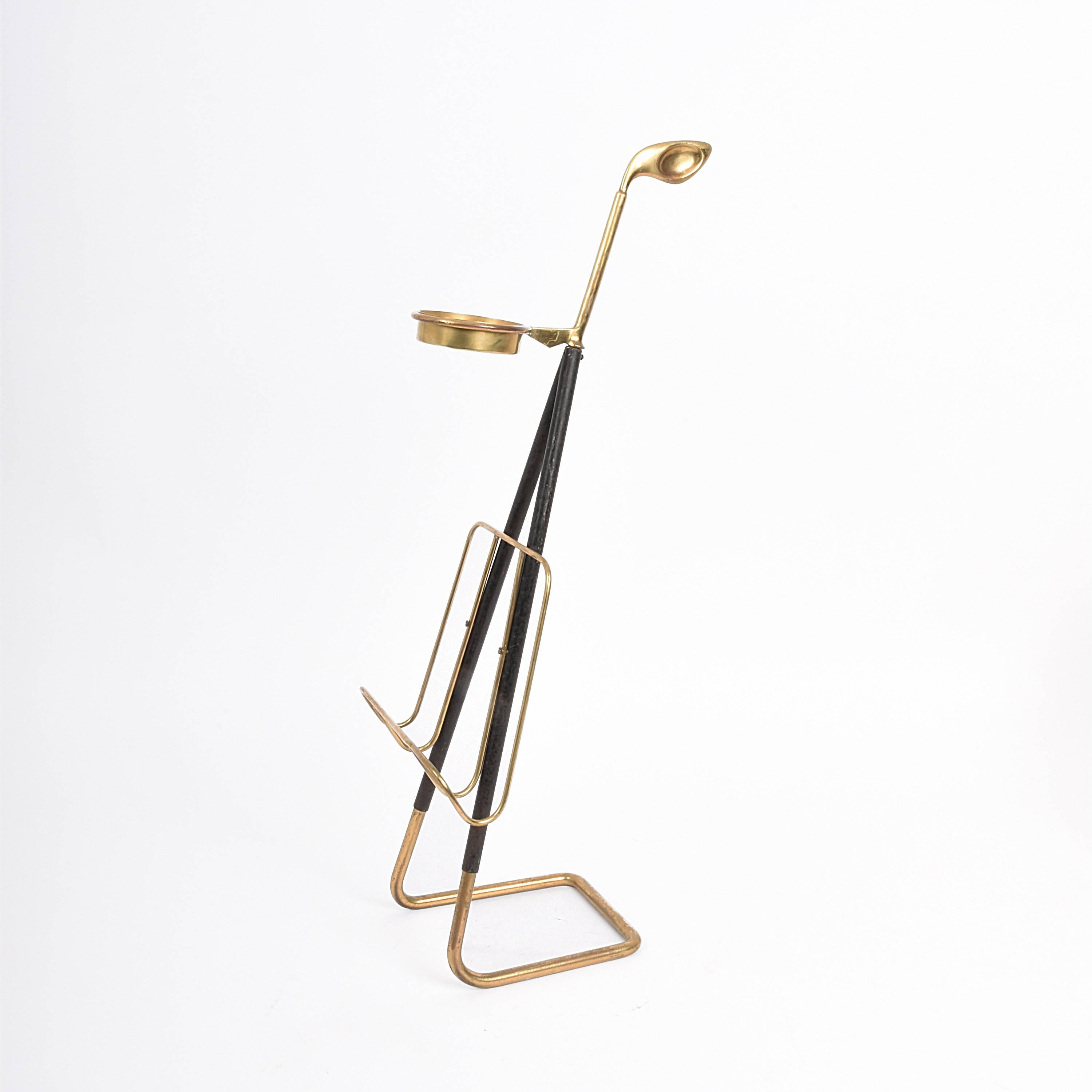 This light and long-limbed magazine rack with the ashtray is representative of the Austrian design during the 50s. 

Made of brass and wrought iron, one of the most extraordinary personalities of Austrian modernism. In fact, this magazine rack is