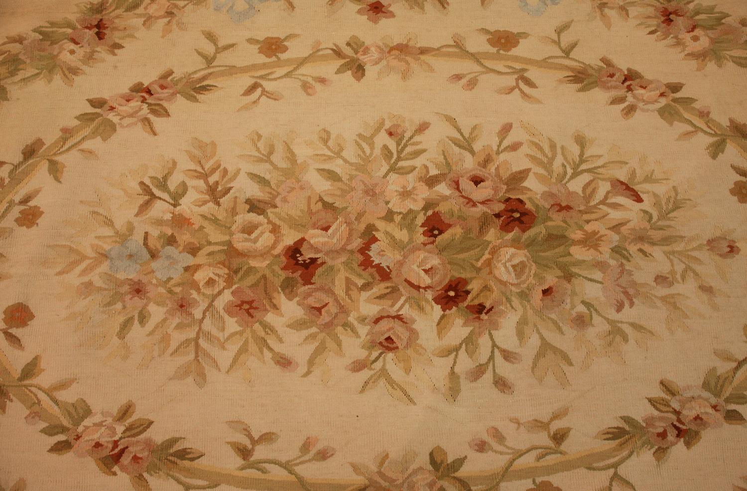 This Aubusson Chinese Flat-Weave Rug with Floral Design is a beautiful and timeless addition to your home. It features an intricate floral design in shades of cream, white, and ivory that will complement any decor. The soft, woolen fabric is woven
