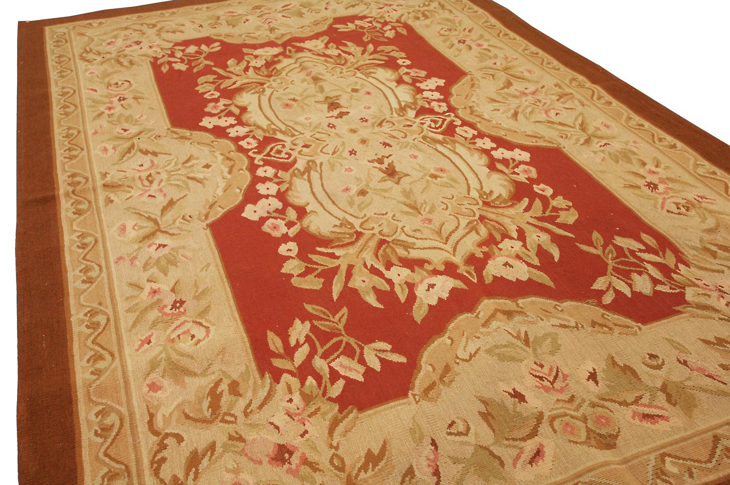 This is an exquisite Chinese Aubusson flat-weave rug with a medallion and floral design. It's perfect for anyone who wants to add some elegance to their home. The ivory color contrasting well with the red brick field is beautiful, and the floral