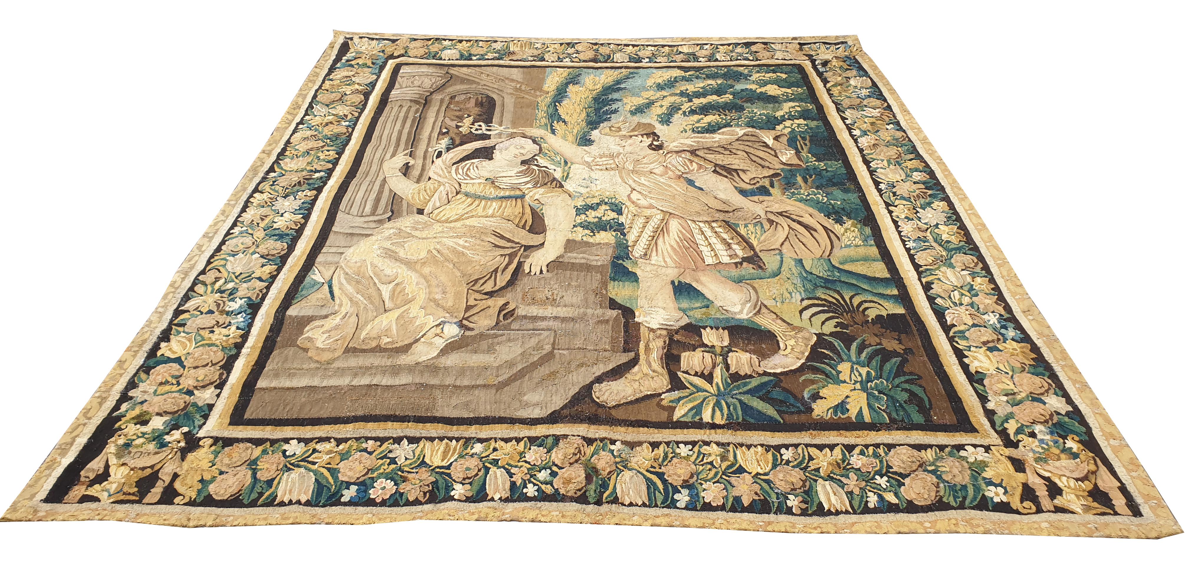 Superb tapestry from the Royal Manufacure of Aubusson from France, dating from the 17th century. 
Representing a doctor with his patient.
A flower garland outline is drawn all around.

This 400 years old tapestry is in perfect condition of