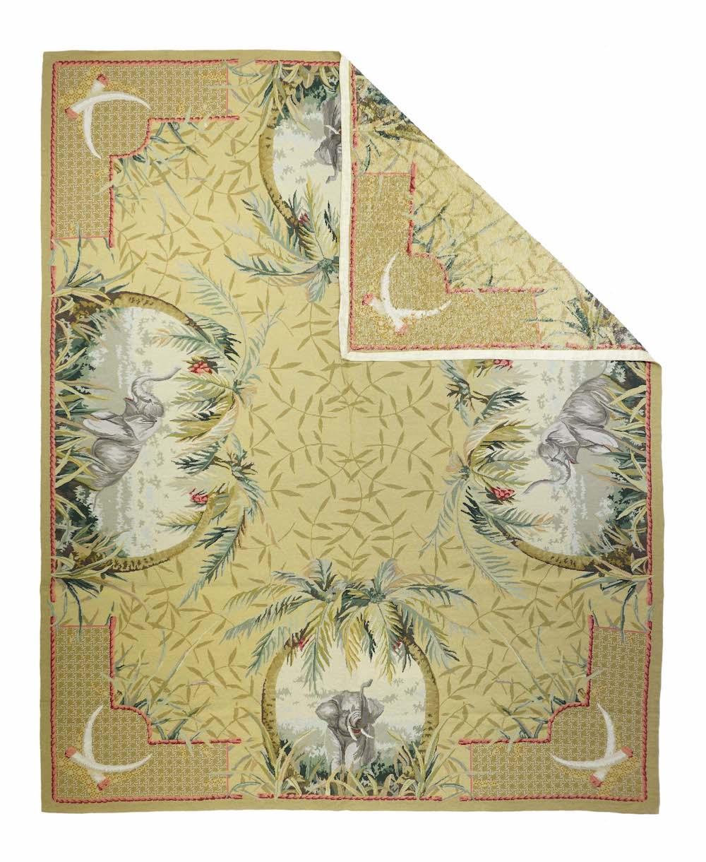Aubusson Needle Point Wool Weave Rug 7'10'' x 9'11''.  Four large oval vignettes of elephants and palm trees accent the ochre field with its allover decoration of bamboo leaves. Broken, dotted main border with corner pairs of elephant tusks. Perfect