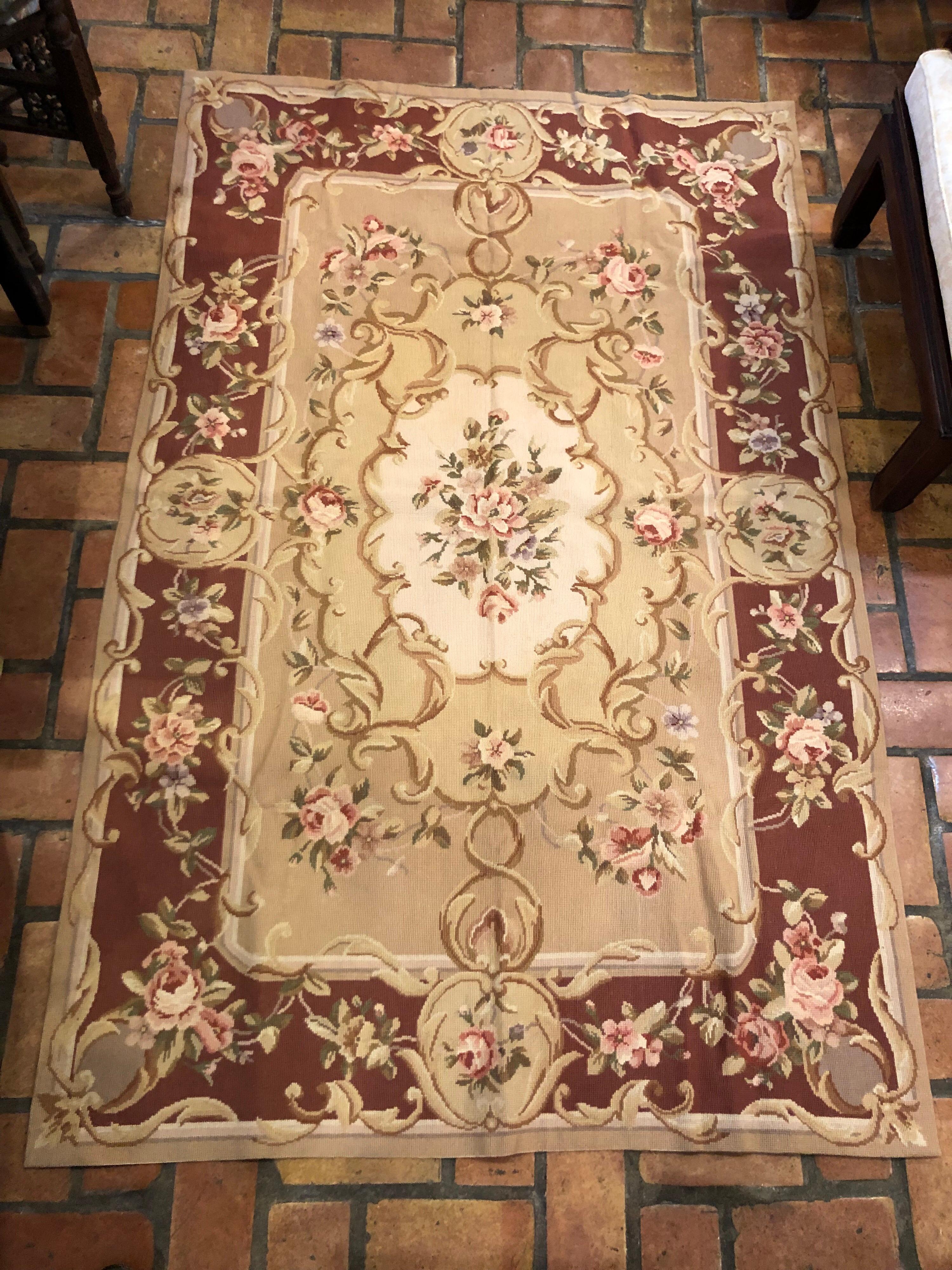 Aubusson needlepoint rug 4' x 6 'new and unused. Rose adorned area rug. Soft shades of brown, tan, pink, sage green and cream/ivory. Perfect for a bedroom or a hallway. This can ship parcel 1stdibs for $45. Please request parcel shipping. Excellent