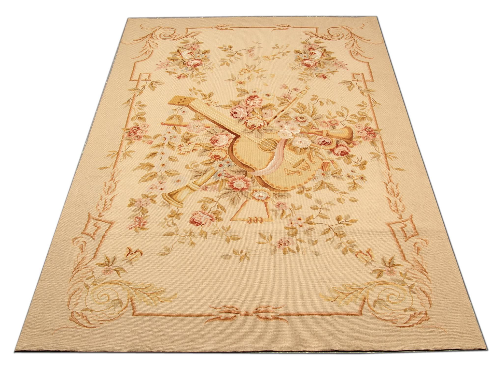 This elegant Aubusson carpet is a resplendent example of the lush architectural style and romantic botanical motifs that captivated European aristocracy for centuries. The softly colored field has a luxurious aura heightened by the delicate color